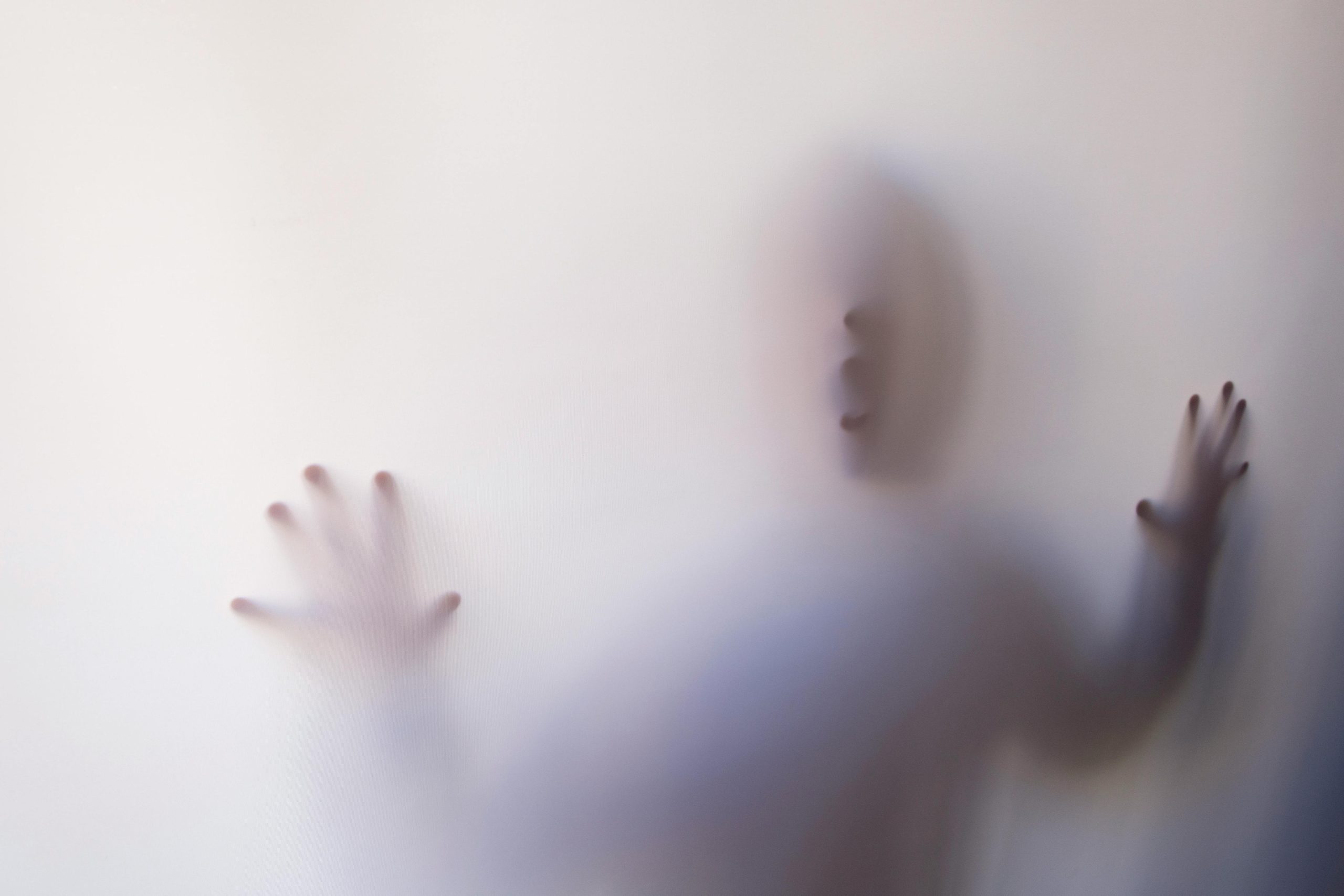 person-behind-white-cover