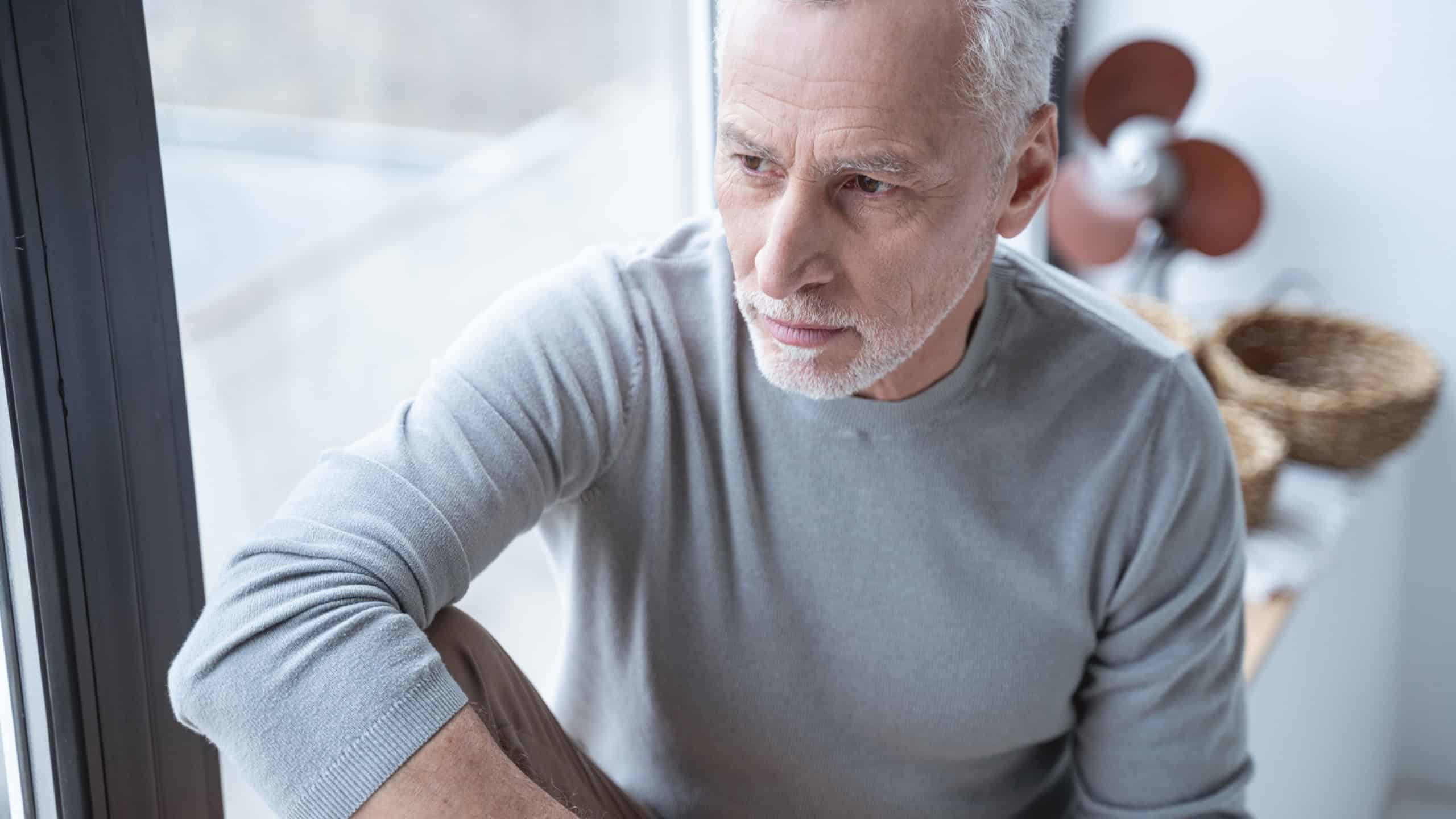 Portrait of a thoughtful adult person looking into the distance