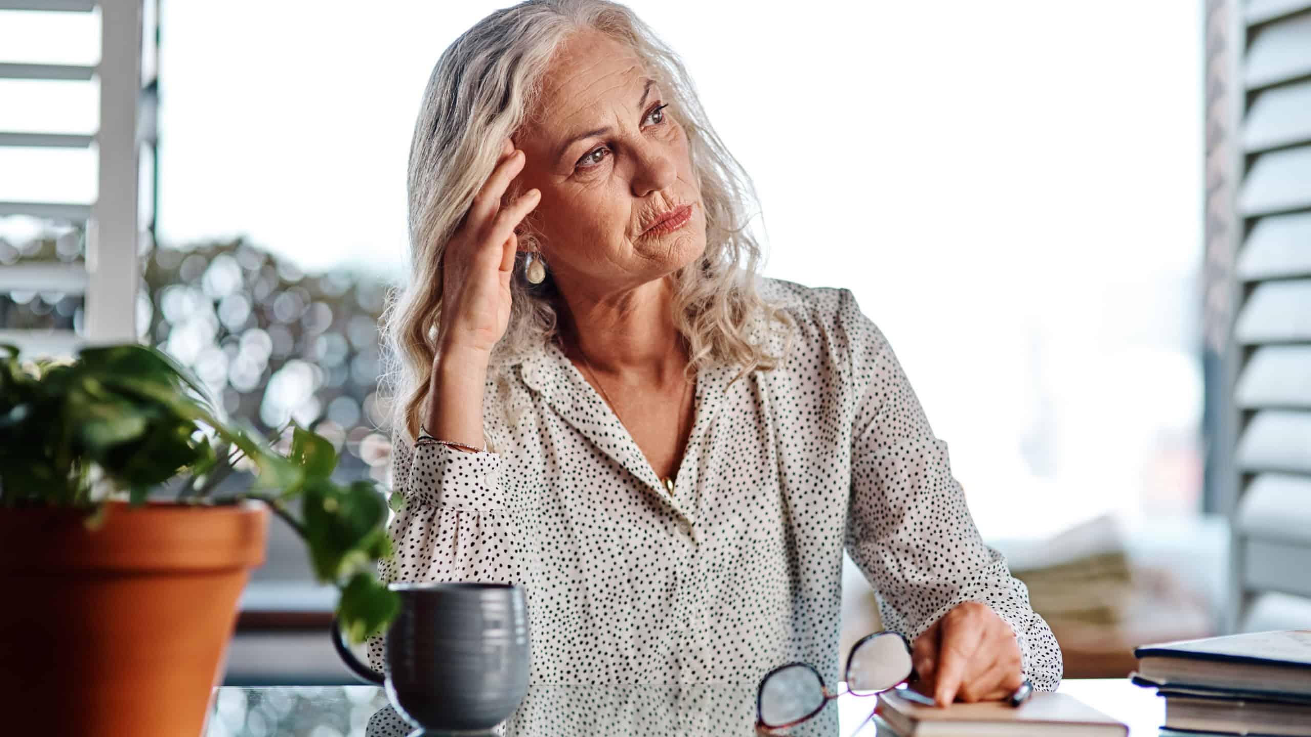 Thinking, mature woman and business in home for remote work, retirement future and financial planning. Startup, female person and brainstorming in workplace for company development and upcoming audit