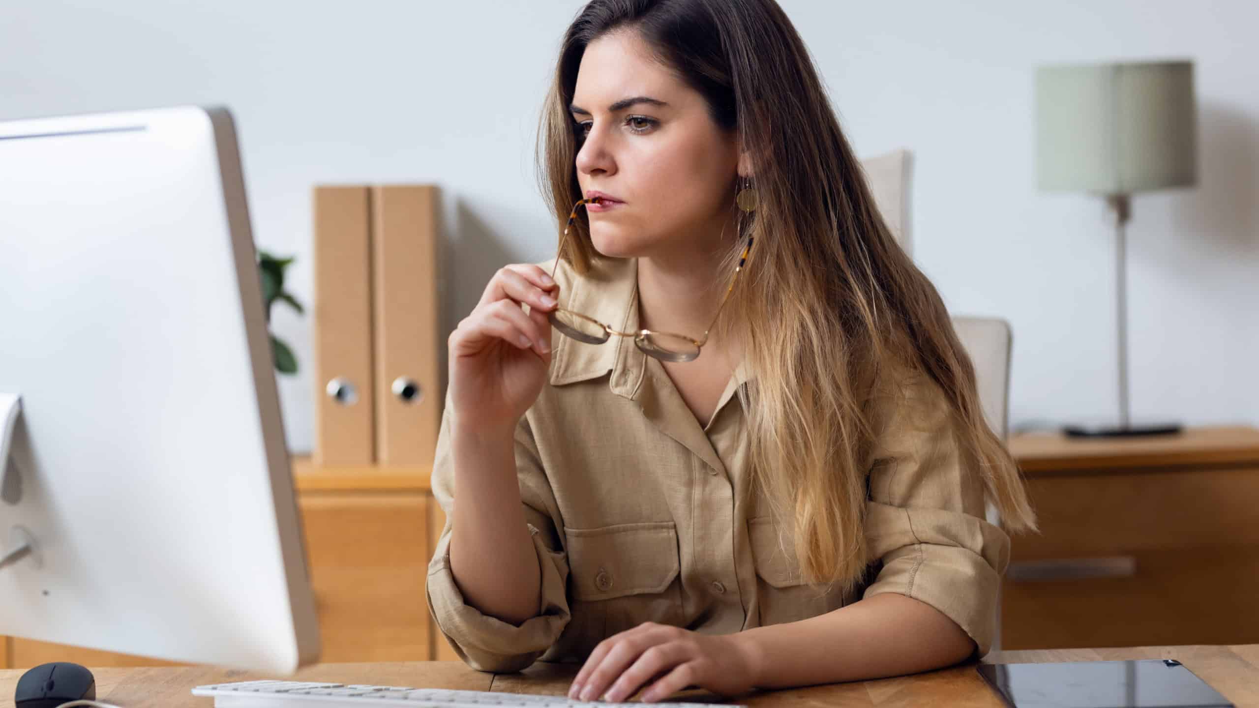 Shot of concentrated beautiful business woman working with computer at the office