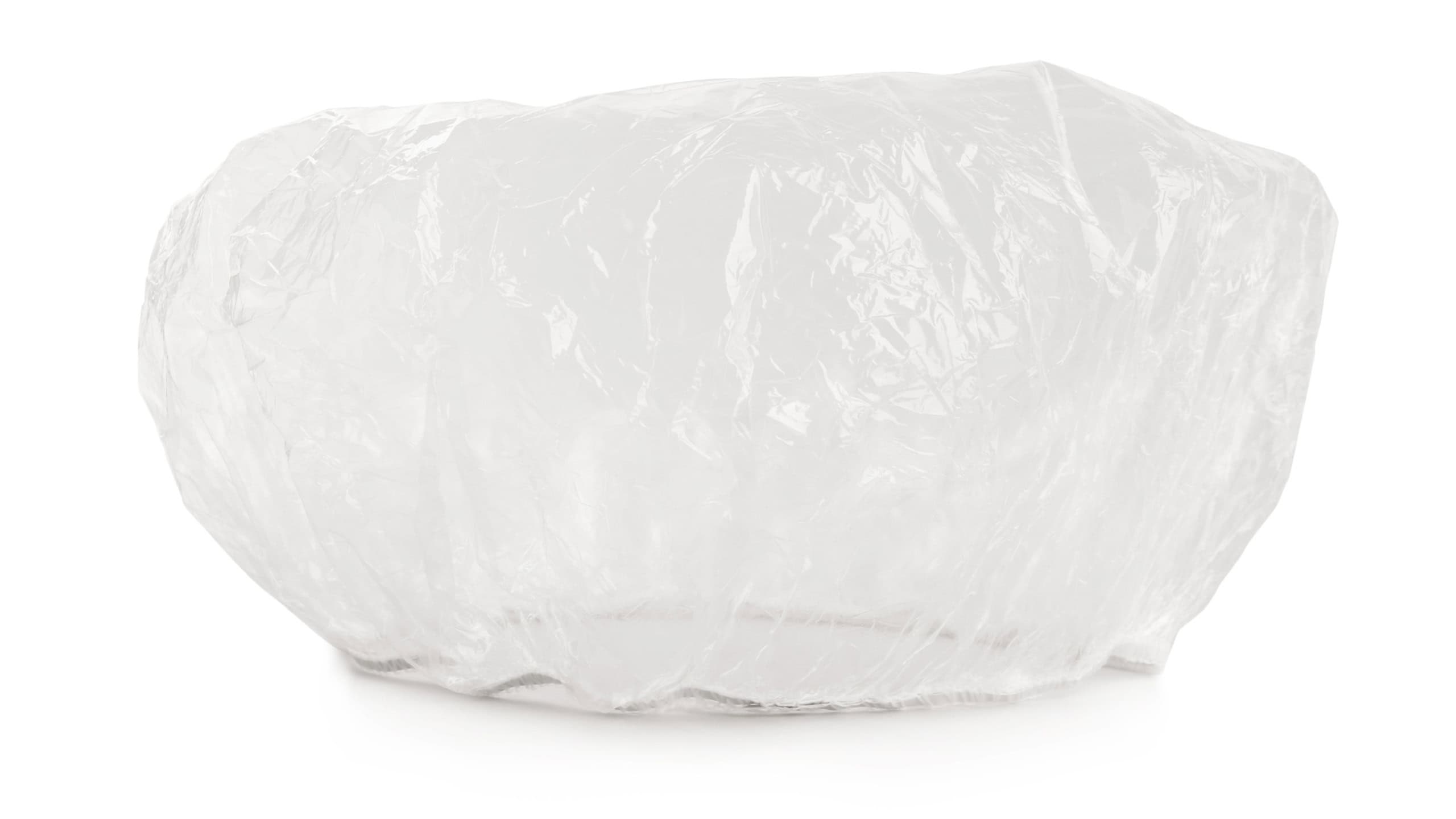 Transparent waterproof shower cap on white background