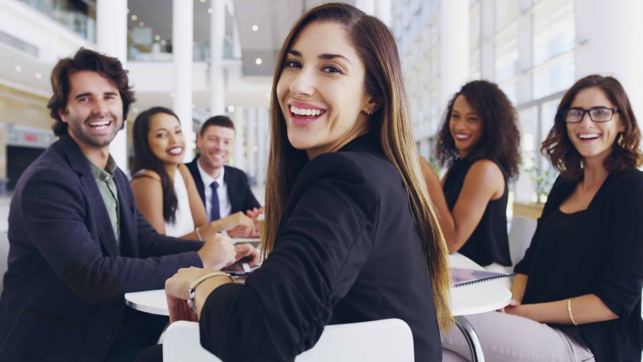 Laughing, happy or business people in portrait for meeting, confidence or practice in workplace. Teamwork, legal attorneys and face of proud lawyer at law firm for court case, litigation and justice