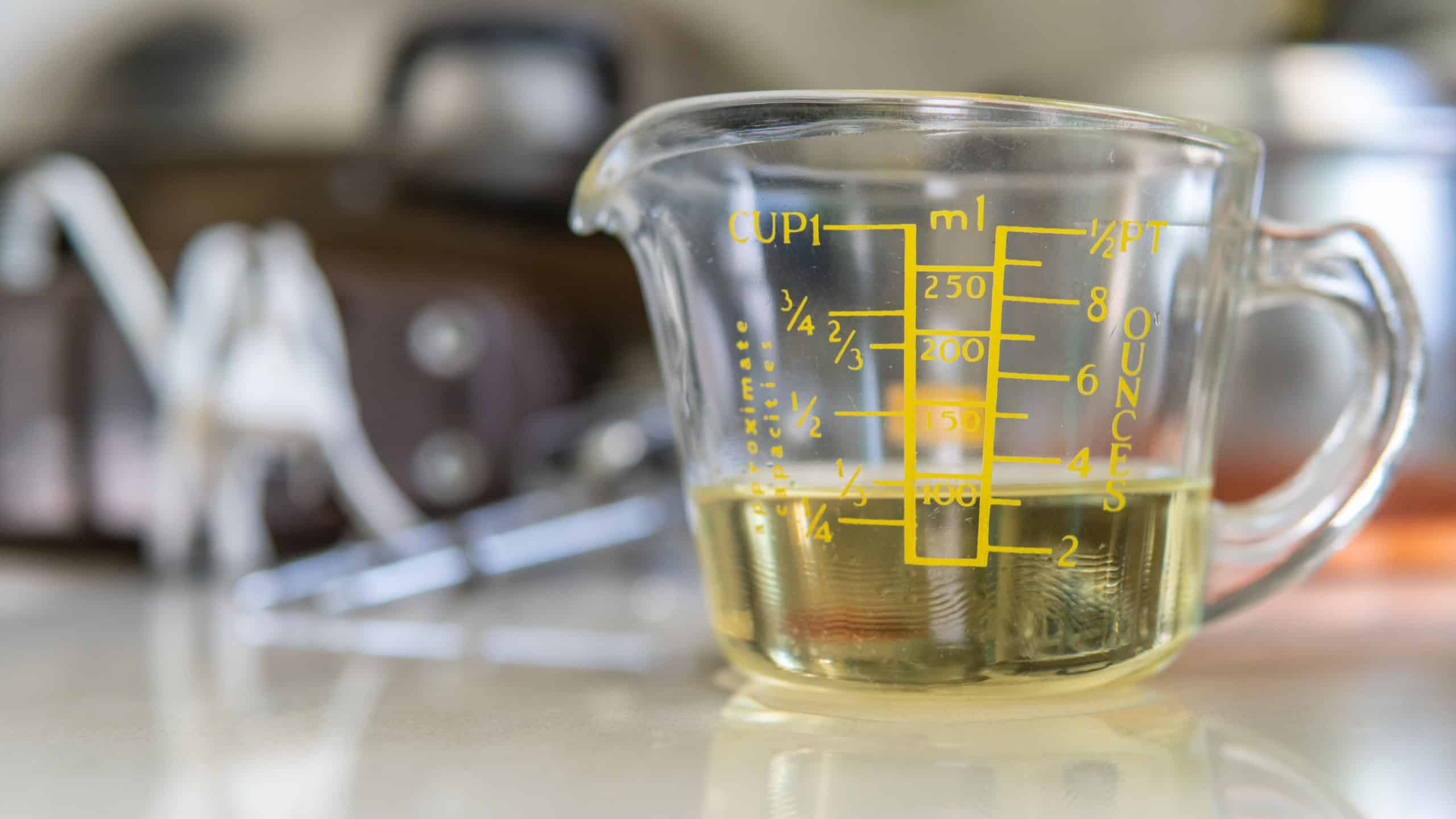 cooking oil on measuring cup for baking use