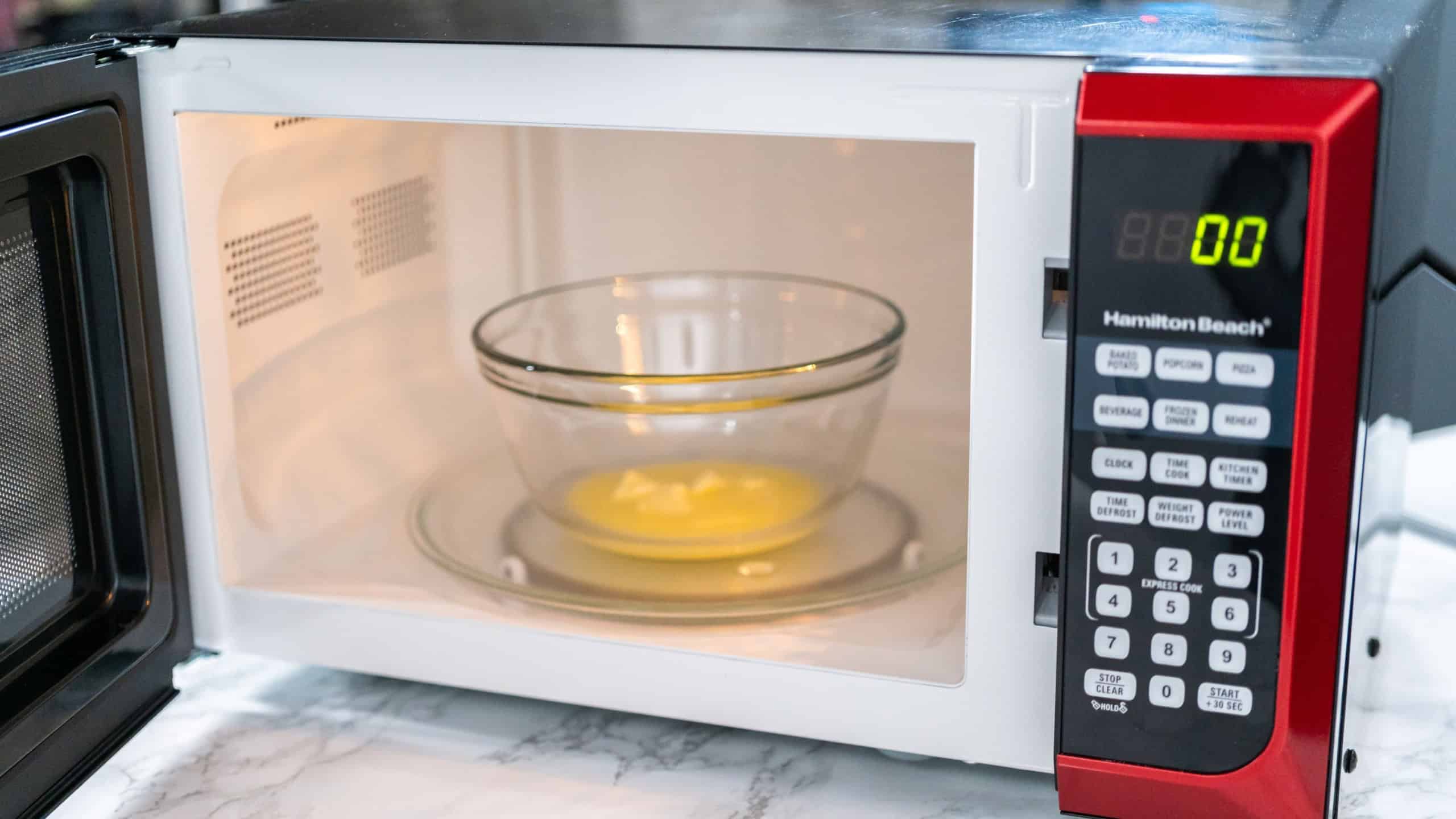 Melting stick of unsalted butter in a microwave.