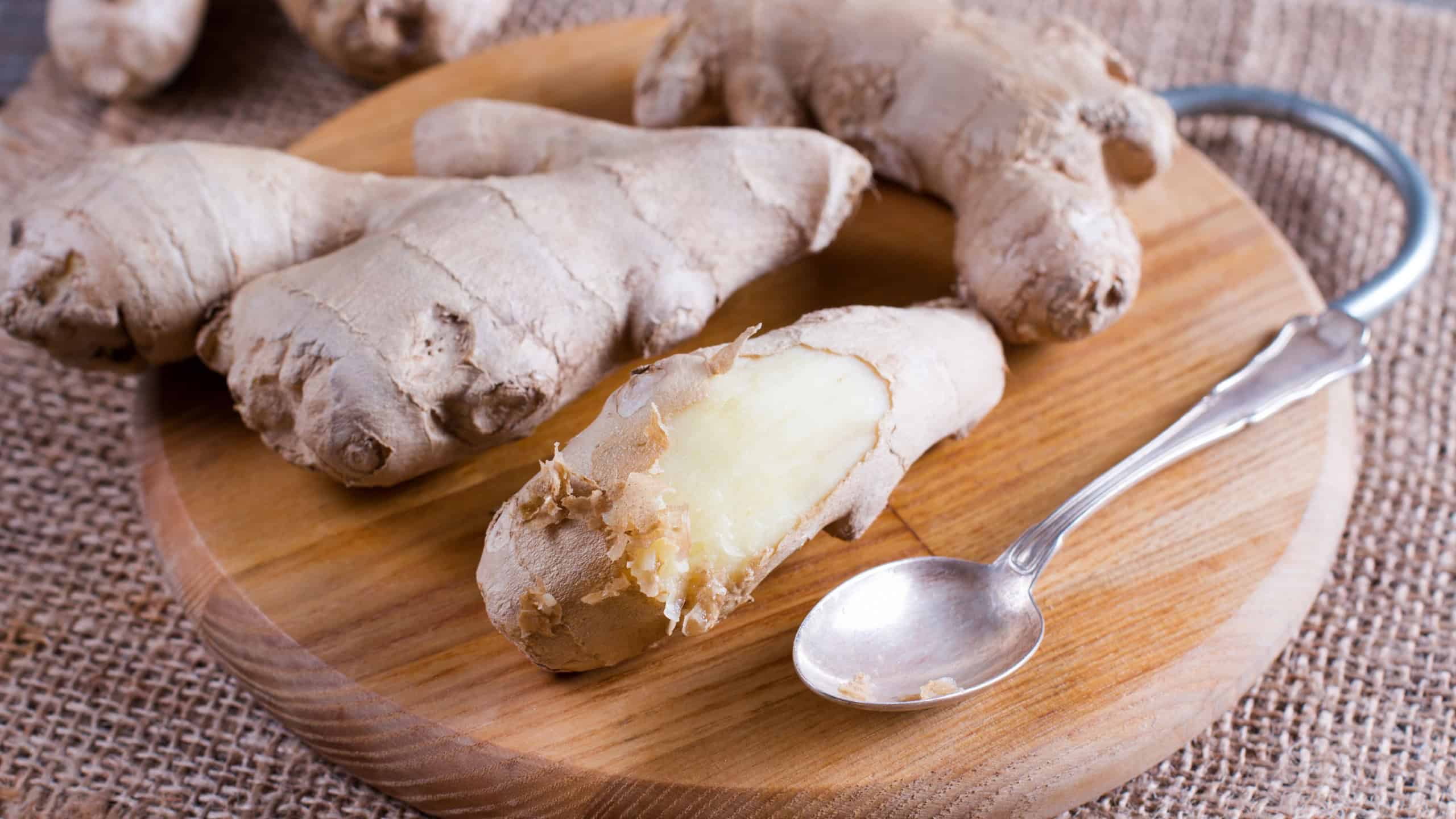 Peeled ginger root with spoon