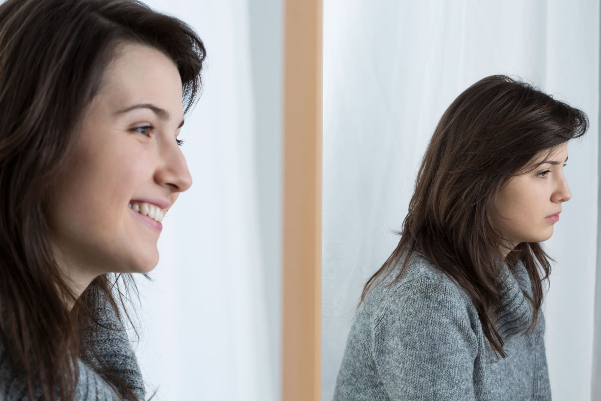Image of upset girl with fake smile