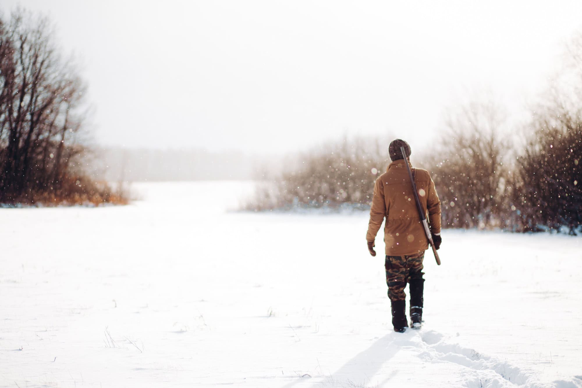 Man securing a reserve. man walking on a snowy day