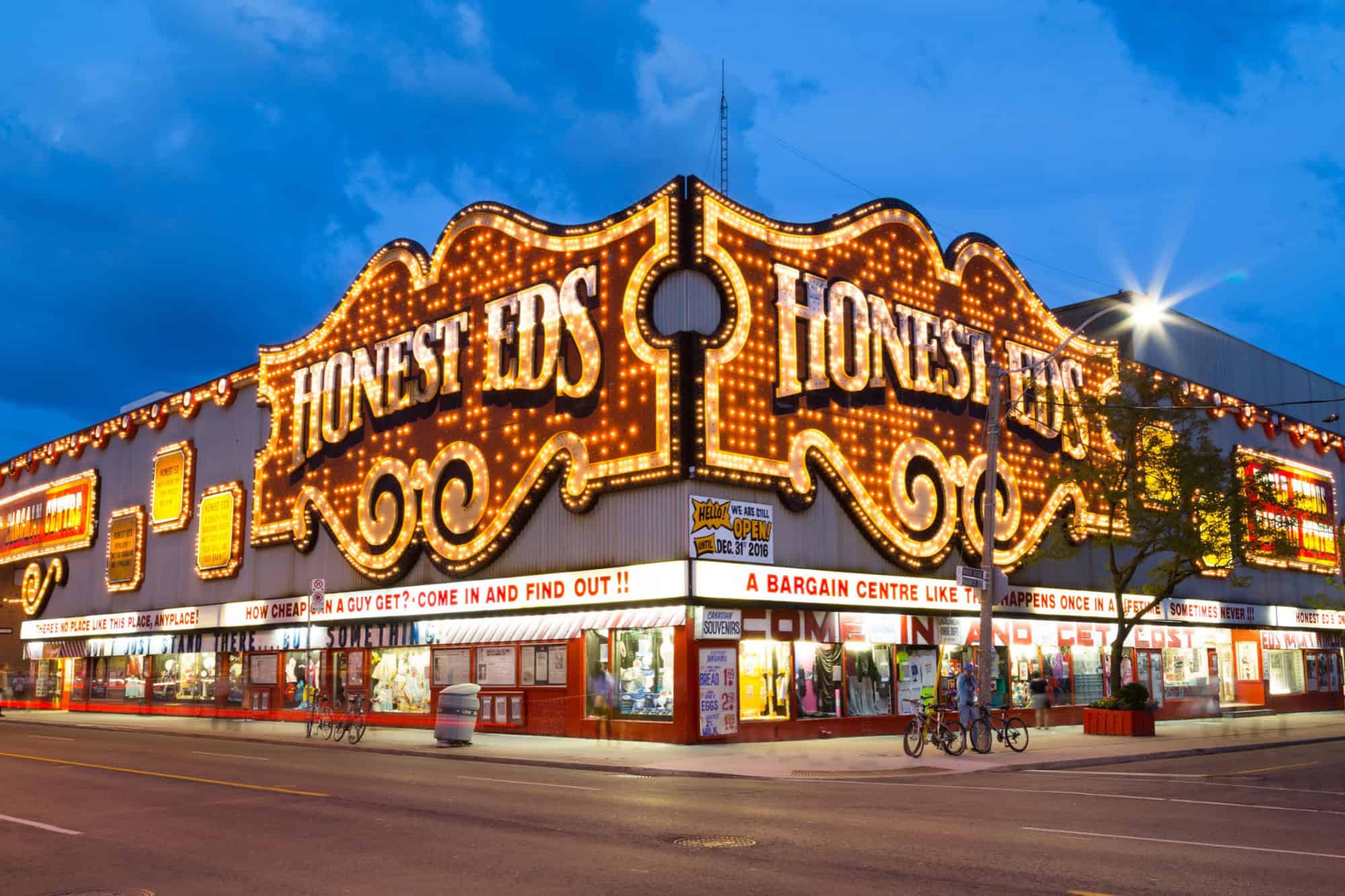 The outside of Honest Eds at night in Toronto