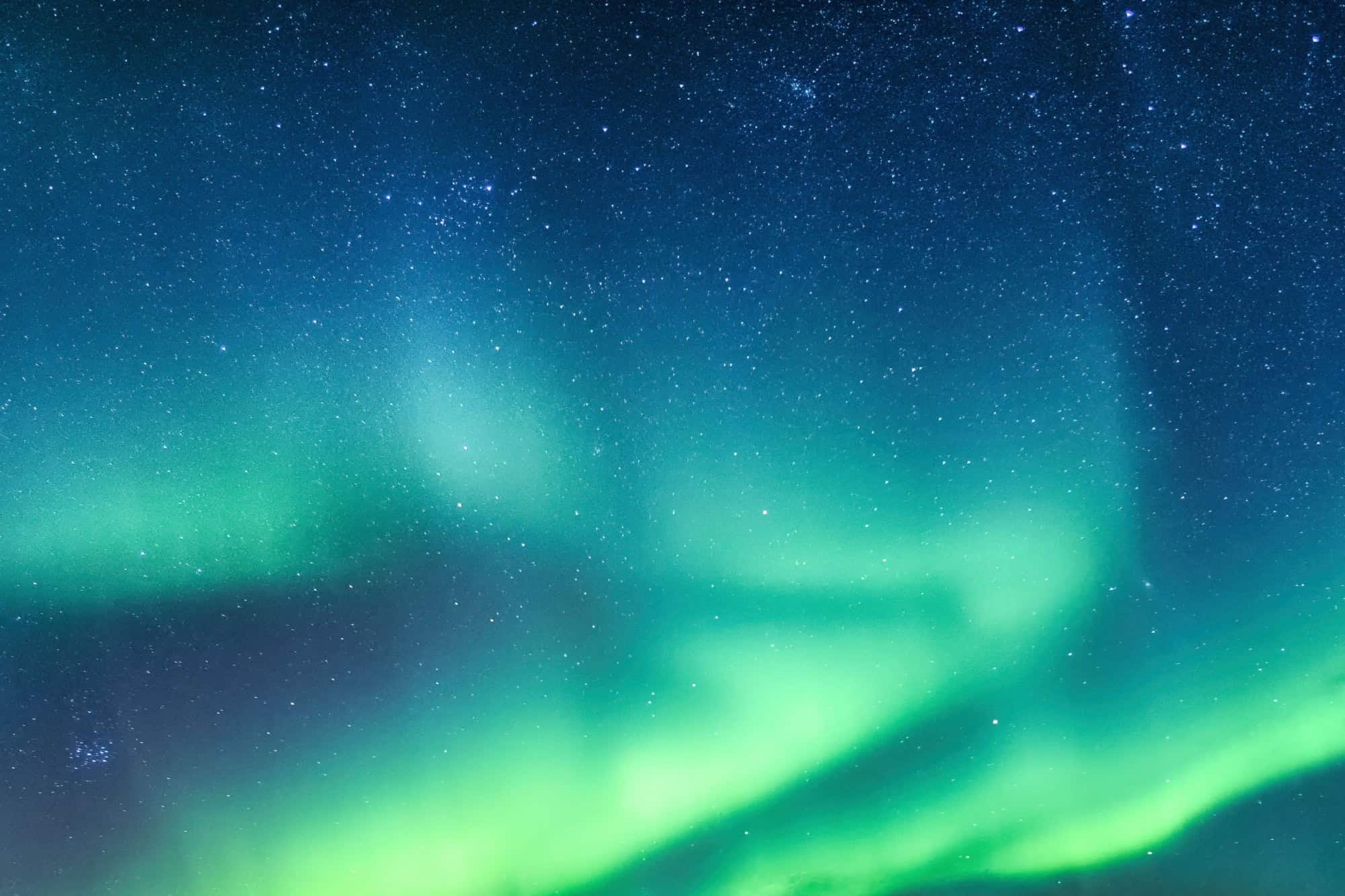 Fantastic Aurora borealis or northern lights with starry glowing in the night sky on Arctic circle at Norway