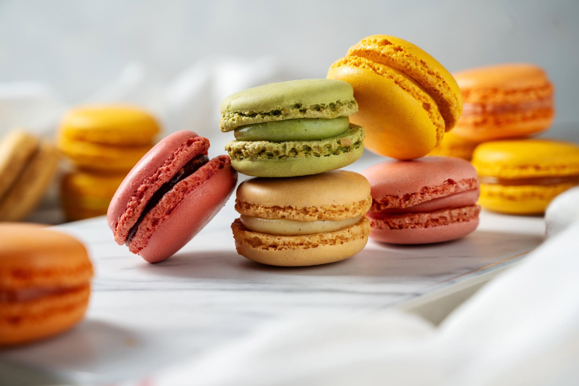 Colorful yellow, pink Macrons closeup. Sweet dessert, sugar
