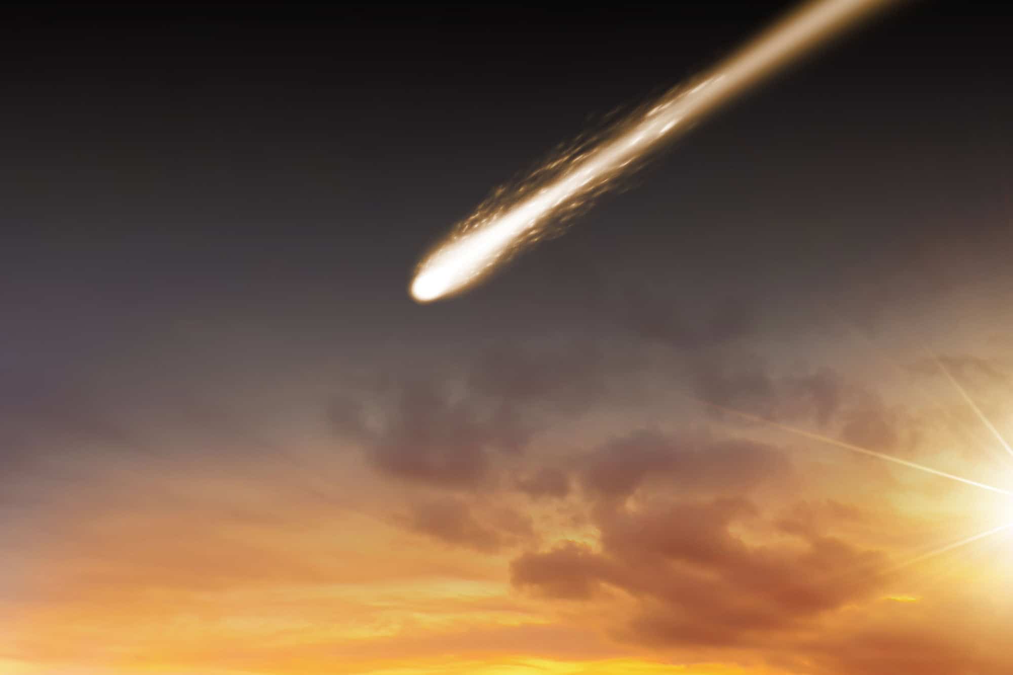 A large meteorite and sunset sky landscape. Falling meteorite, comet, asteroid
