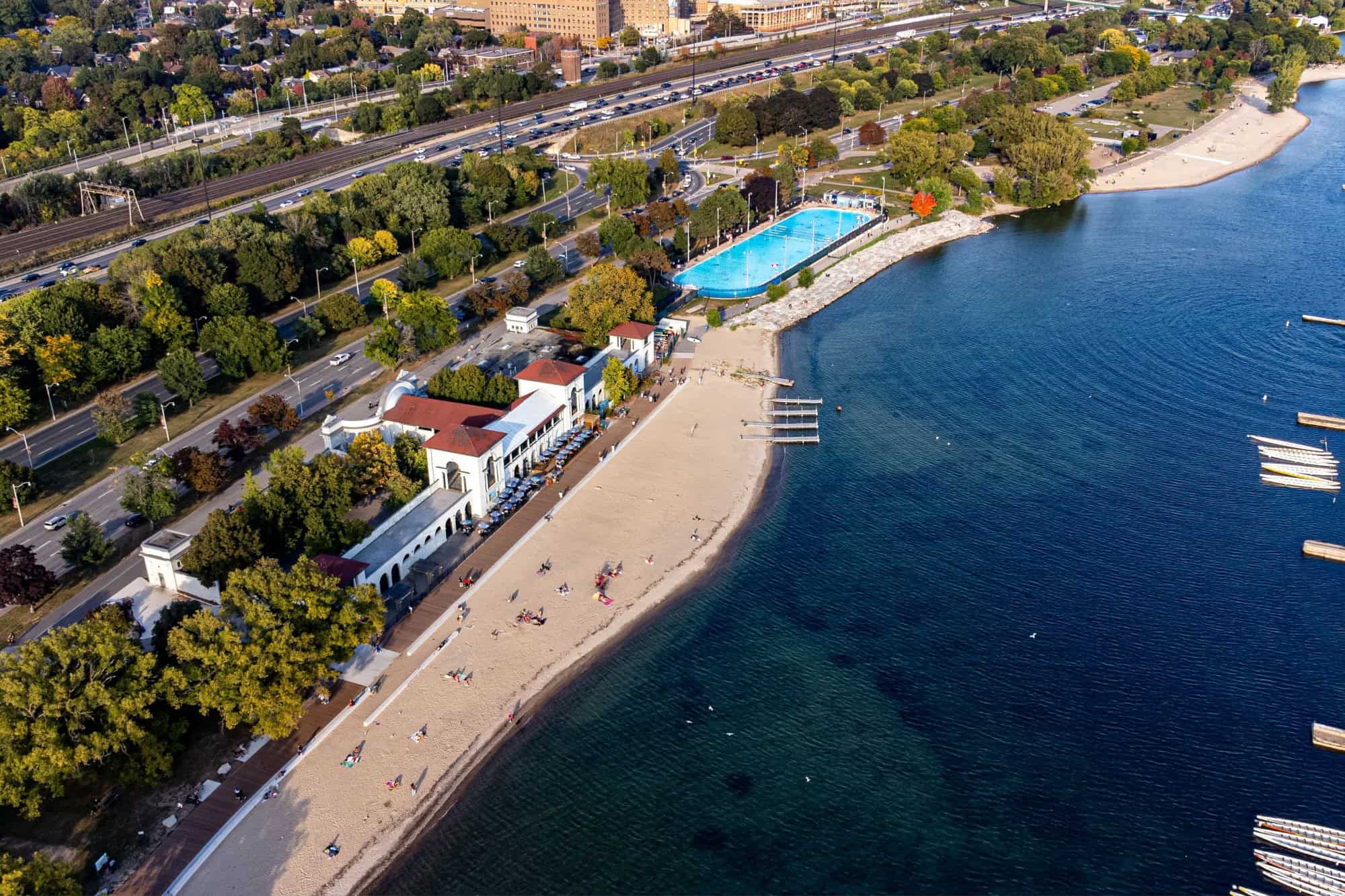 Aerial view of Sunnyside Beach Park with waterfront and swimming pool. 
