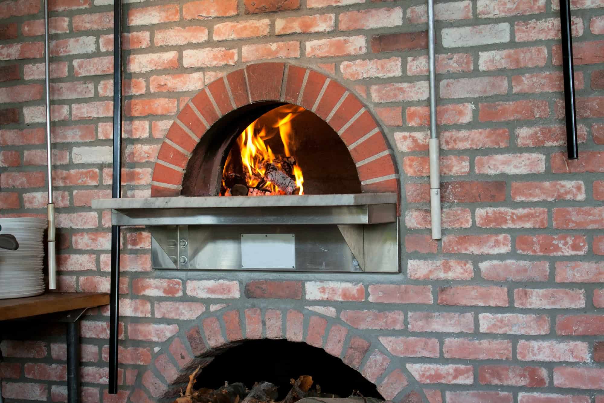 A wood-fired pizza oven in the classic Napoli style.