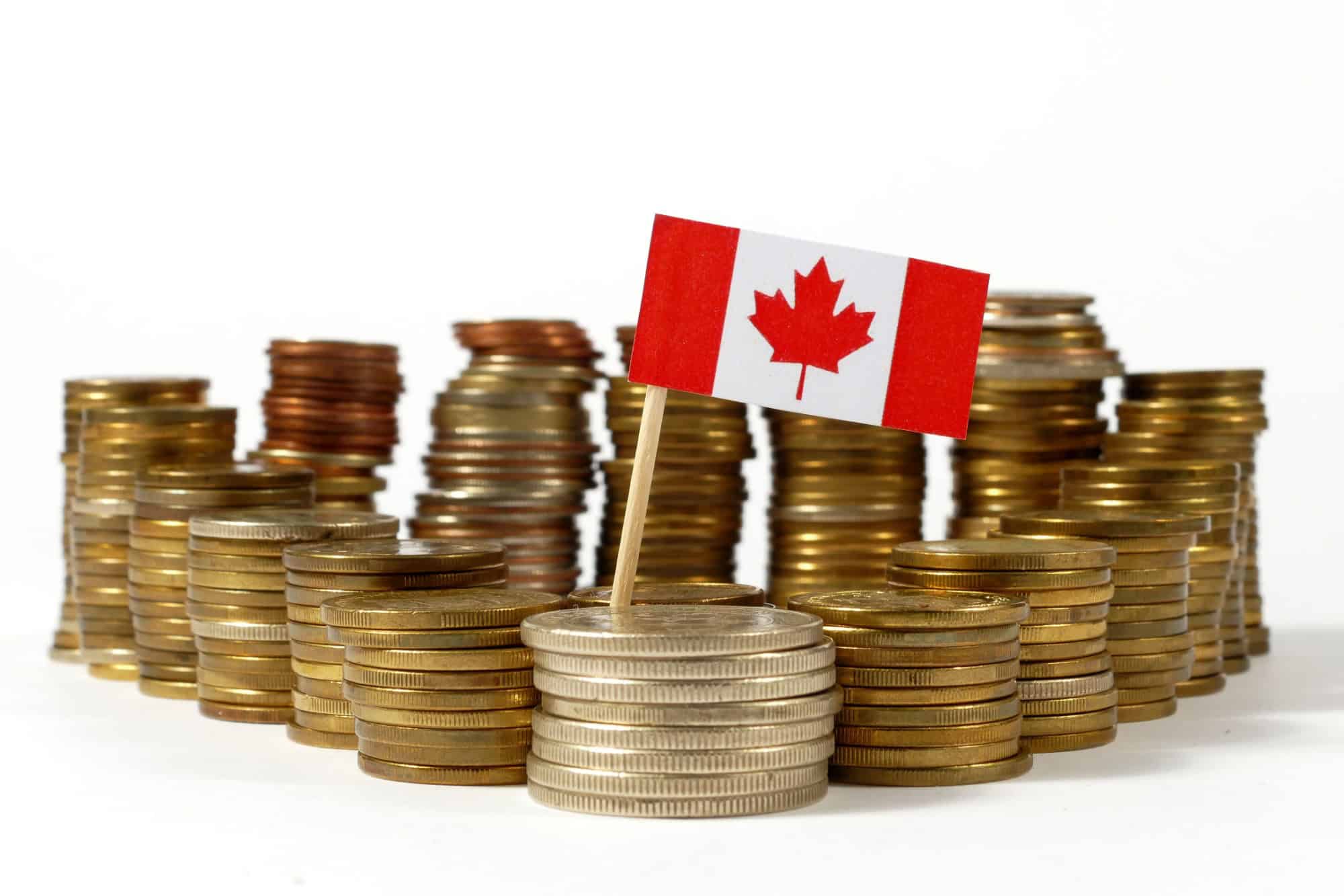 Canada flag waving with stack of money coins