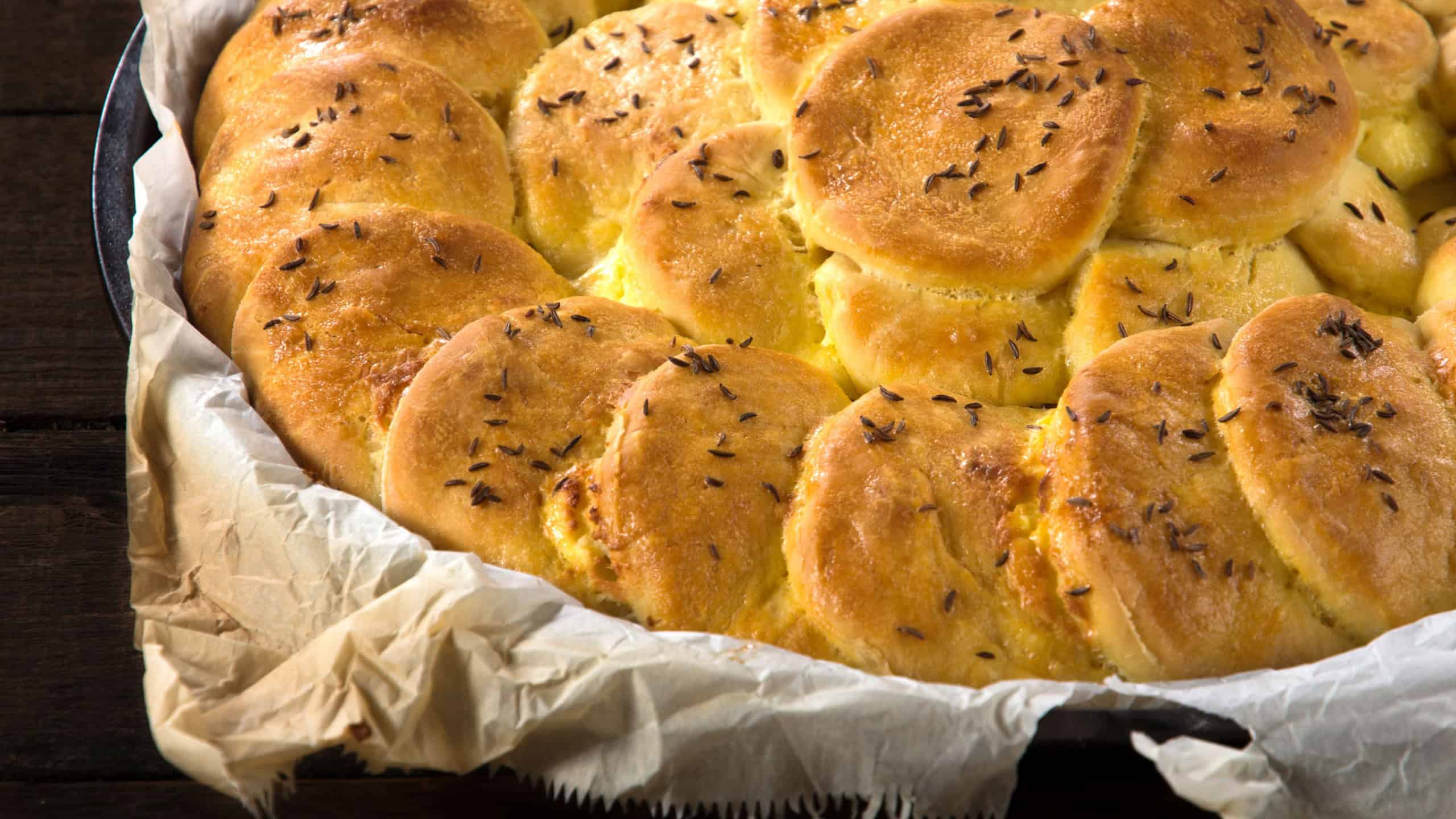 Bannock stuffed with cheese and cumin on the top
