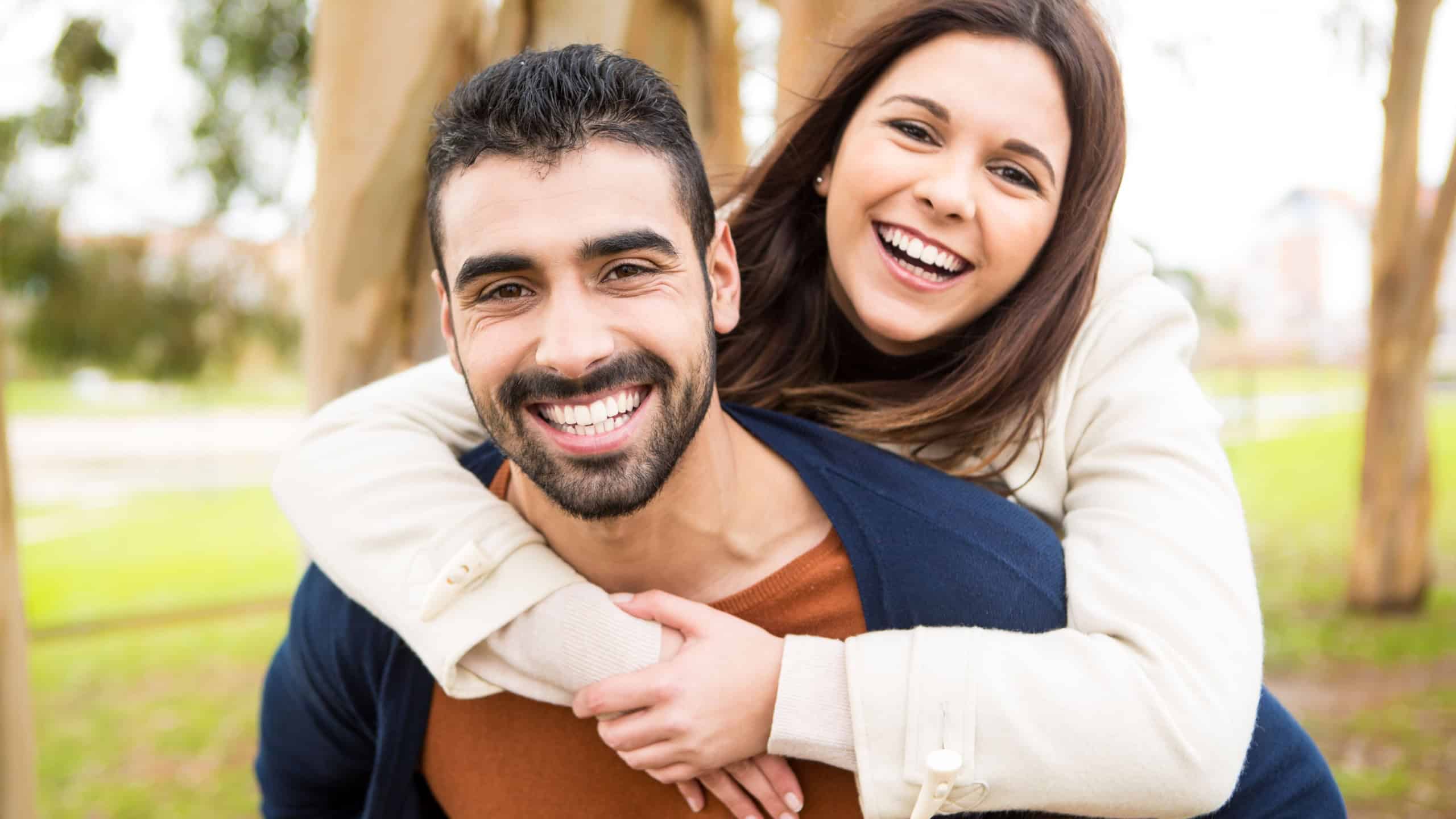 Lovely couple hugging each other in the city