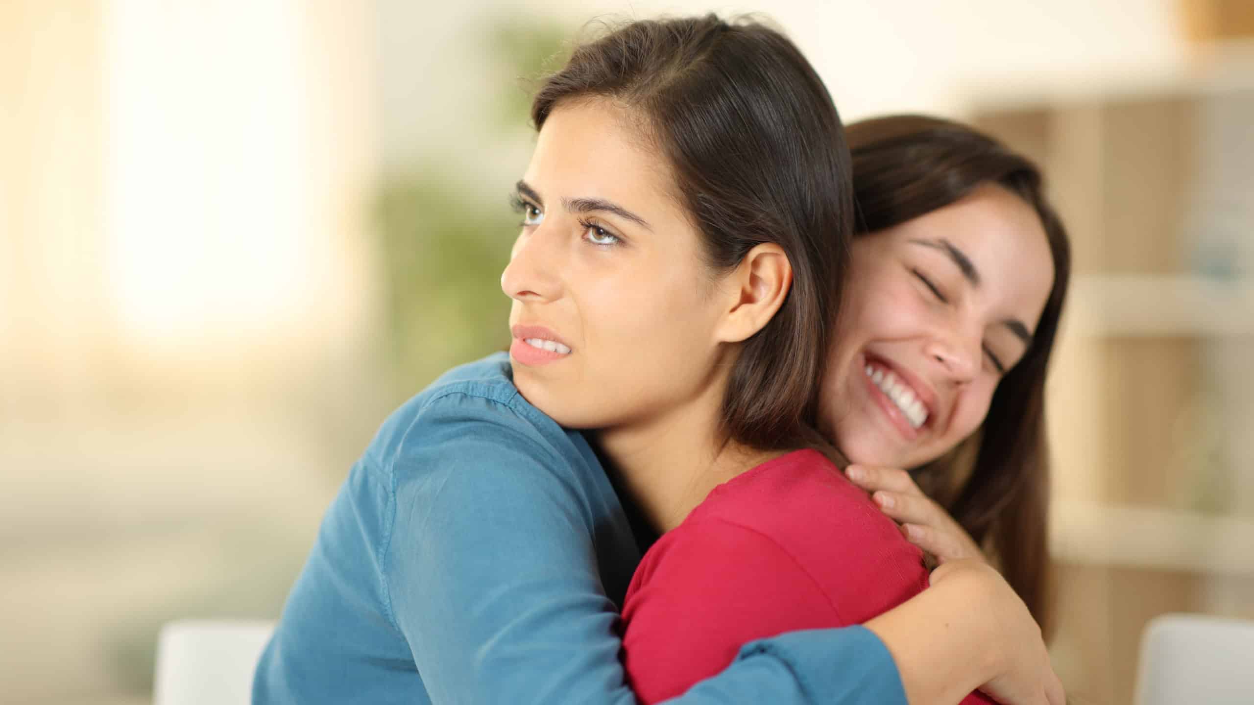 Happy woman hugging a fake friend in the living room at home