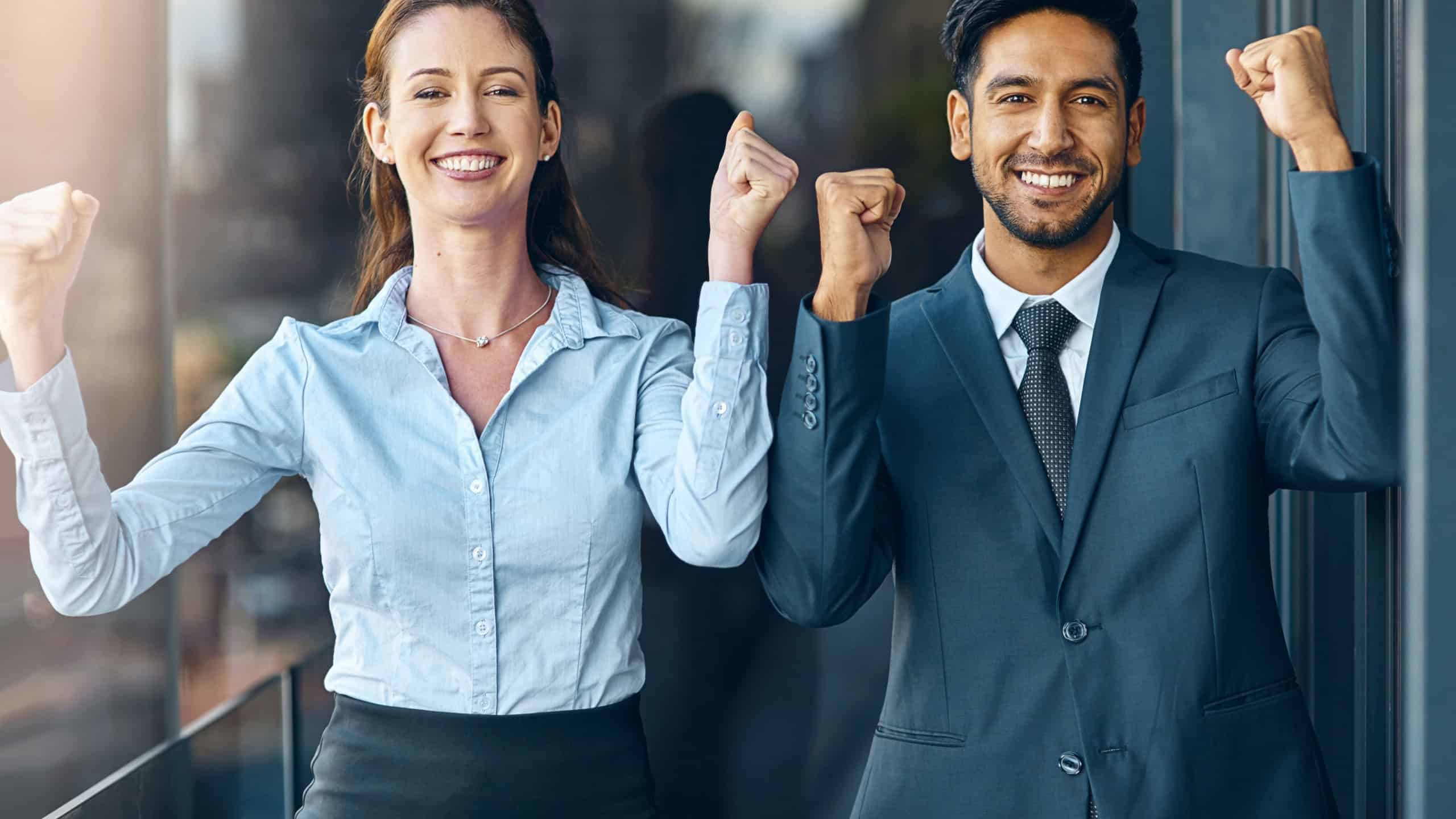 Business people, teamwork and yes for success, achievement or celebration of legal case at law firm. Corporate lawyer, attorney and paralegal with fist, power and resilience with winning in portrait