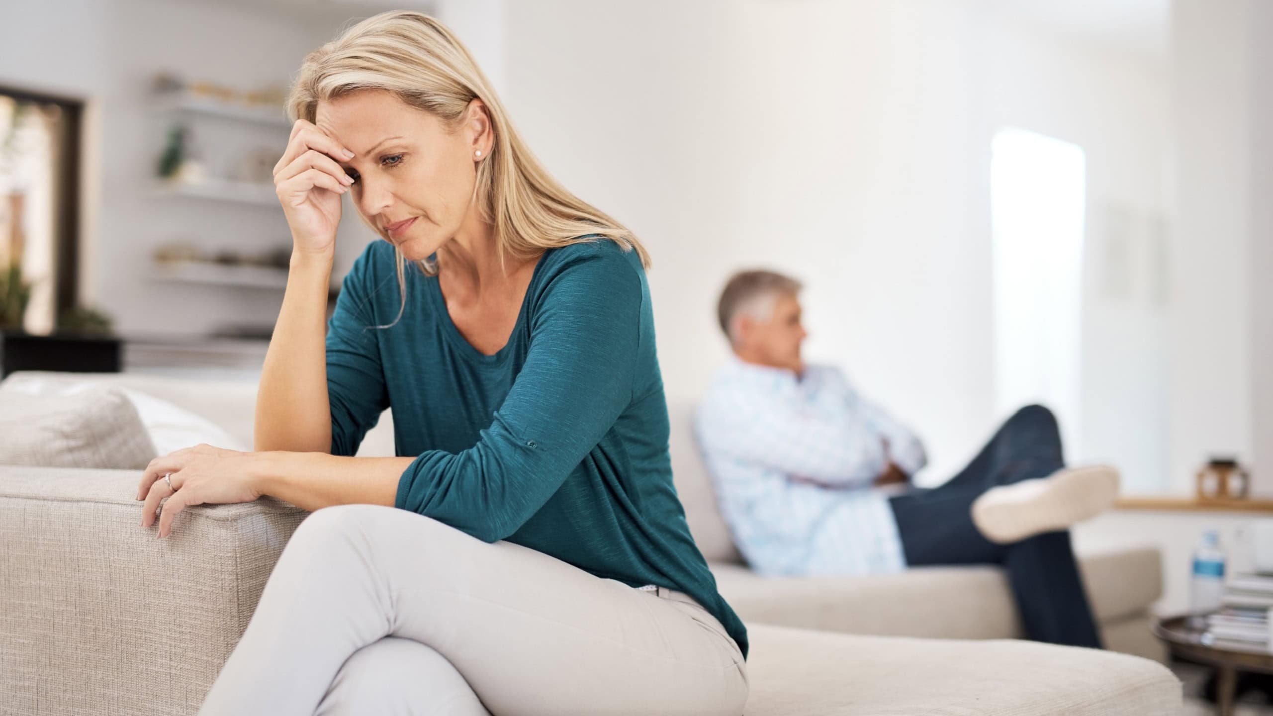Couch, couple and fight in home for annoyed, divorce or married people for argument. Disagreement, sofa and lounge for frustrated woman, affair or emotion in toxic relationship with mature partner