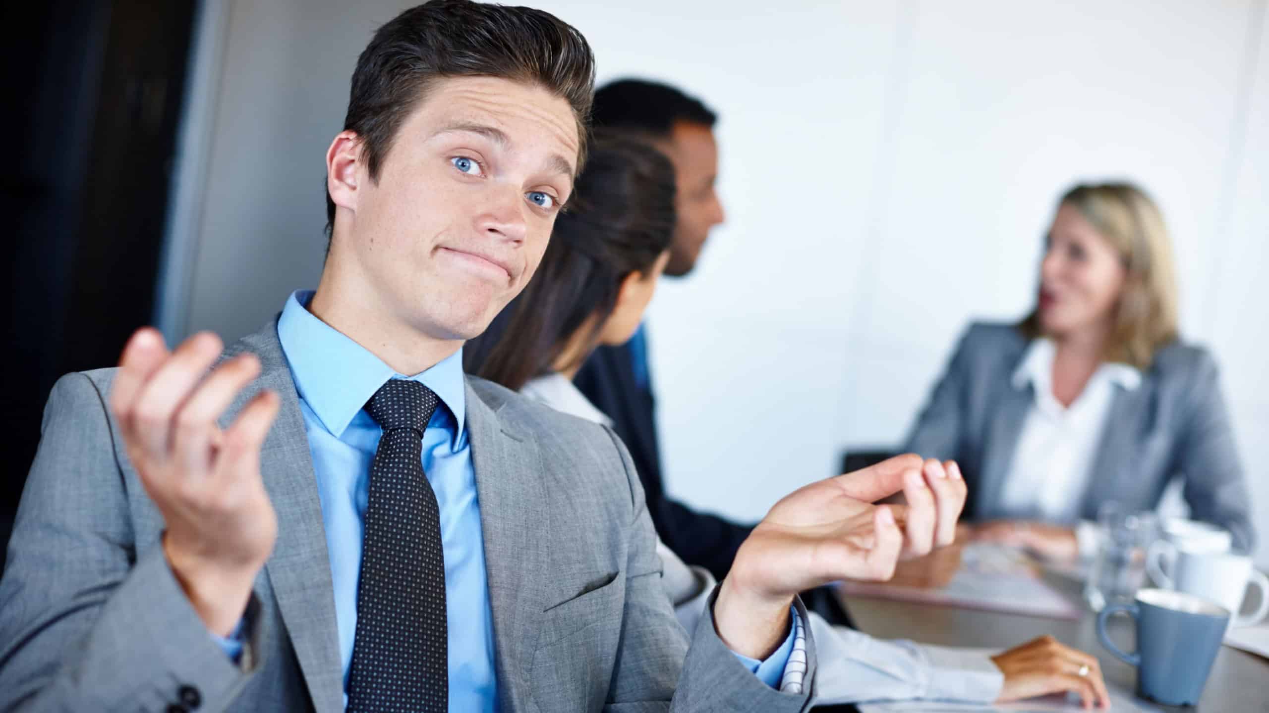 Business man, confused and question in meeting with shrug, doubt and office decision. Corporate, uncertain and boardroom with professional, staff planning and brainstorming for work option at job