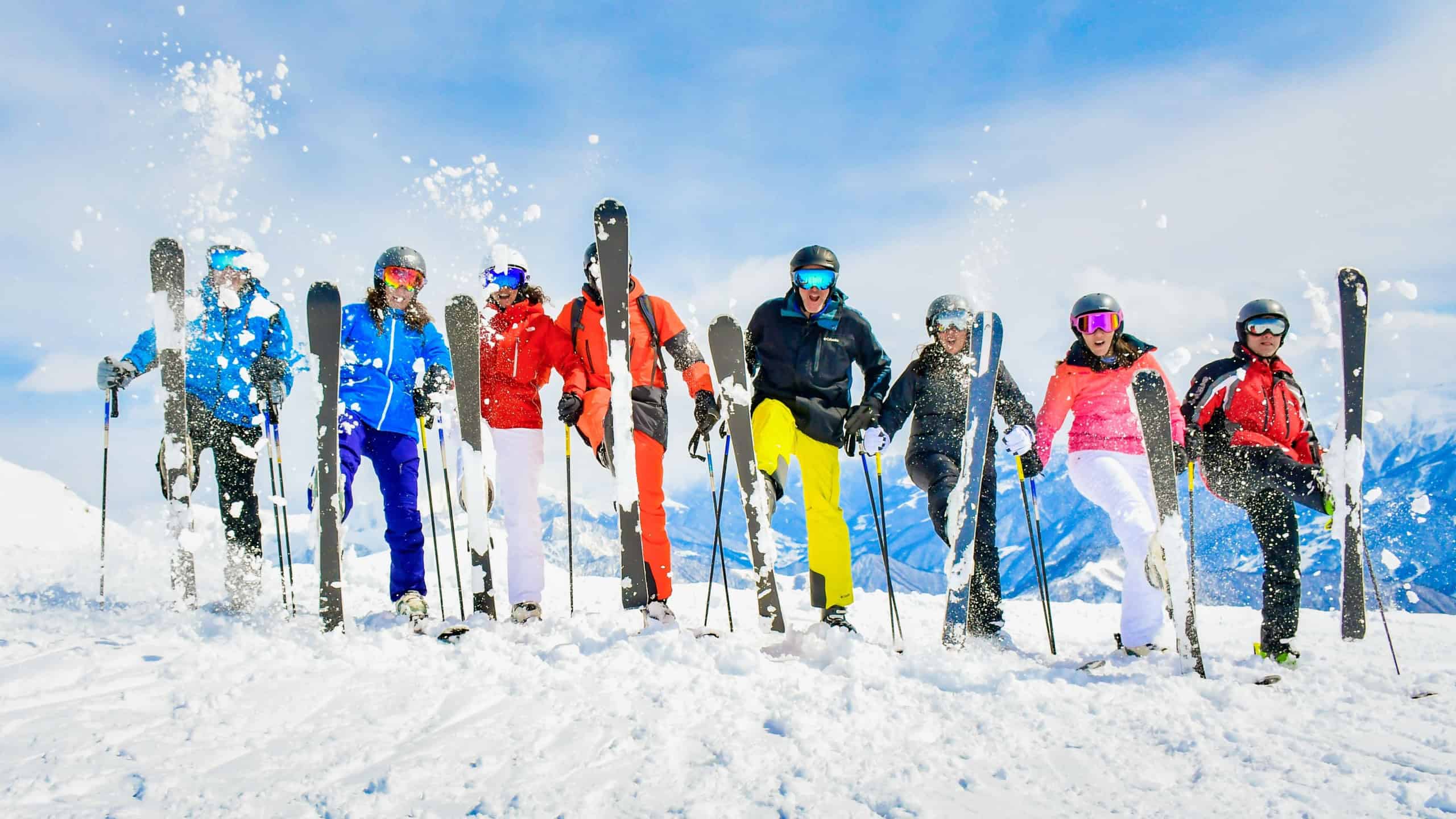 Large group of friends excited skiers couples have fun together