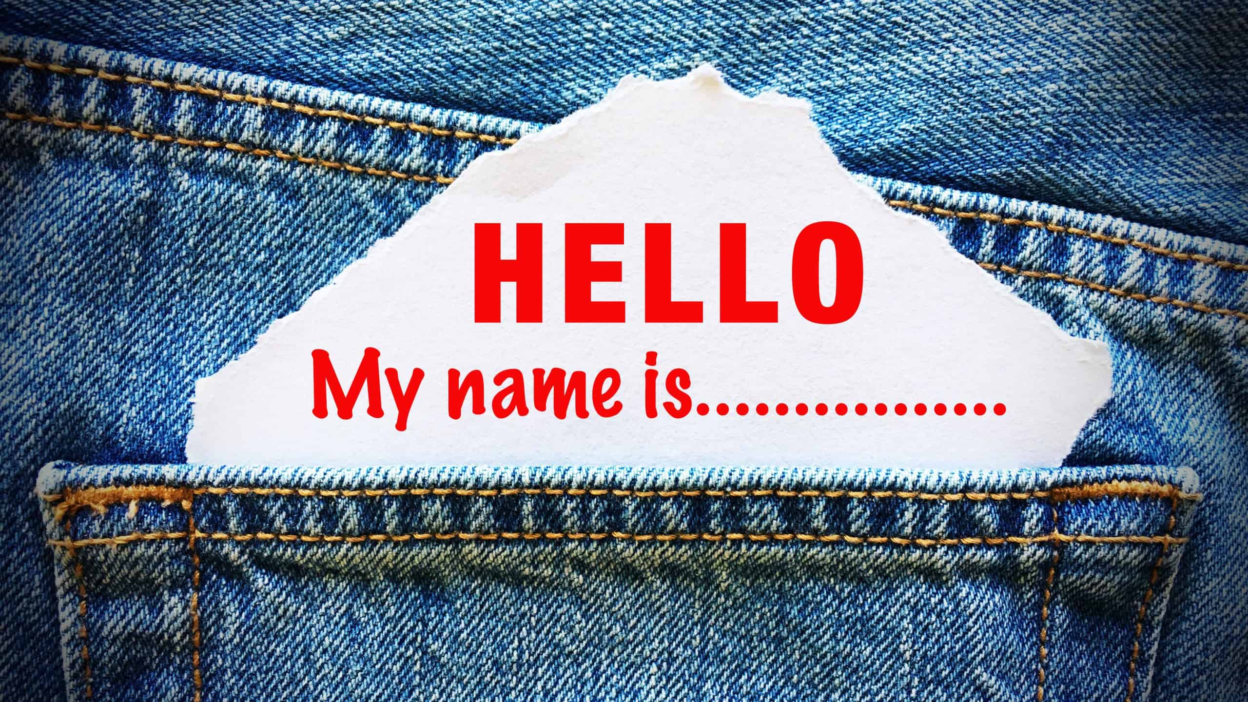 Hello my name is on white paper in the pocket of blue denim jeans