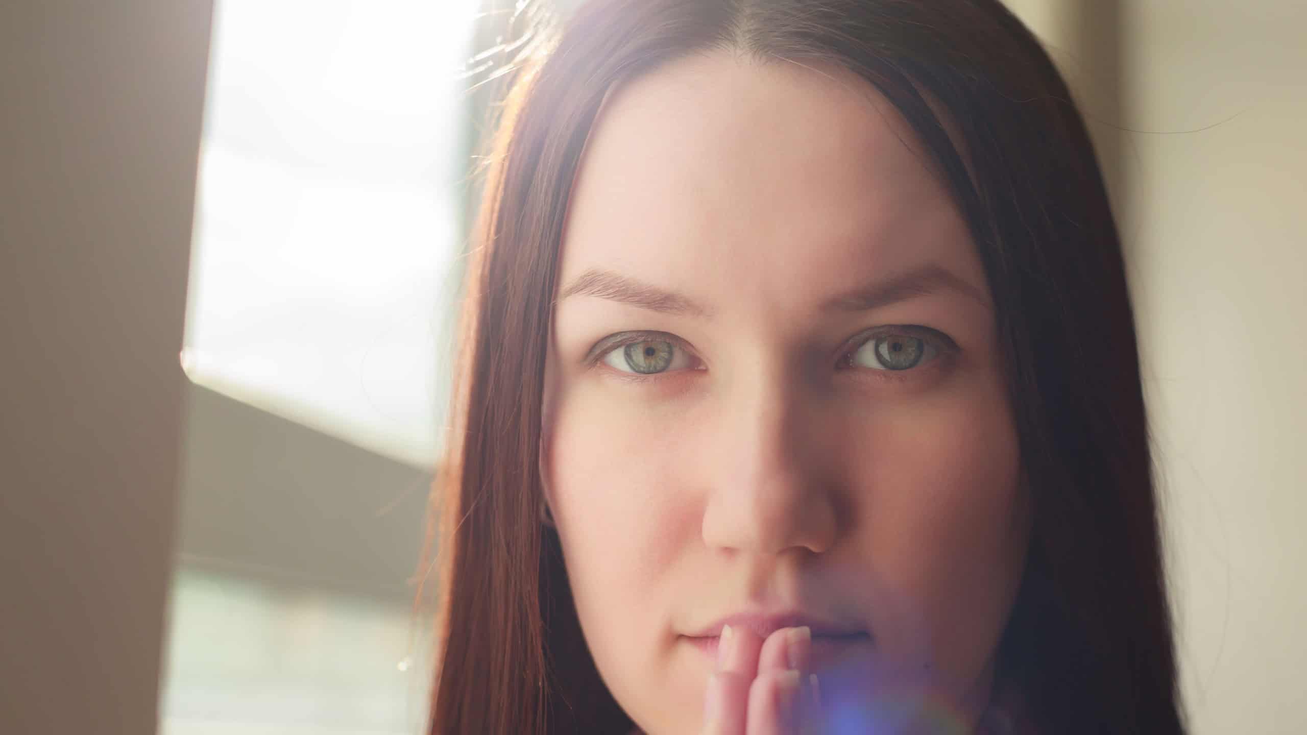 Girl with opened eyes think about future, praying to God