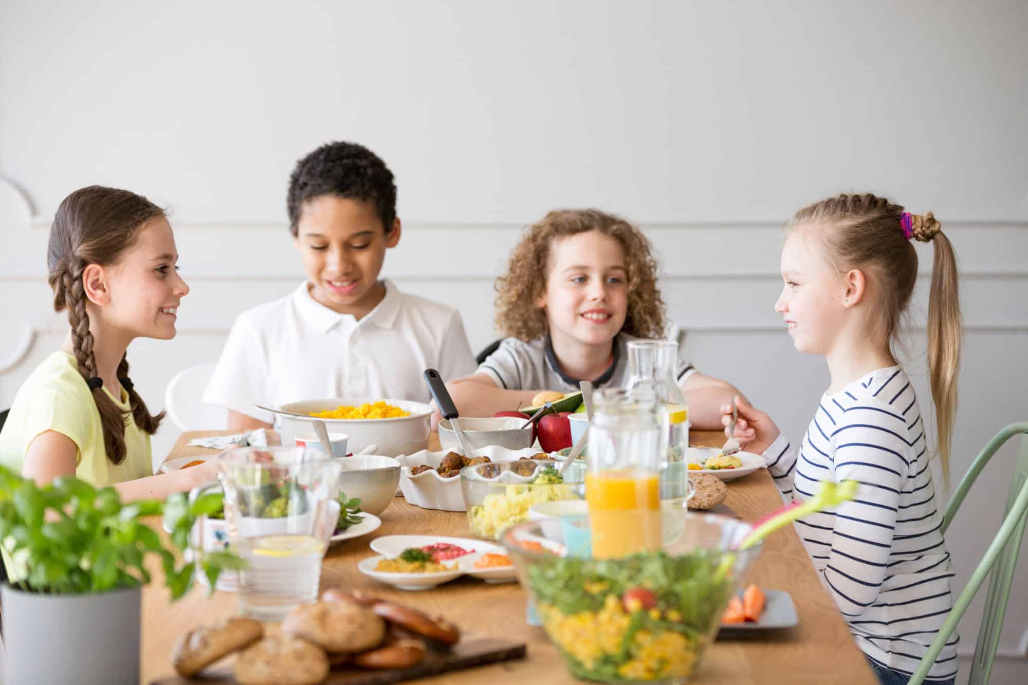 Living room home with confetti, balloons and party decorations having a disaster with trash and a mess after celebrating a birthday party 