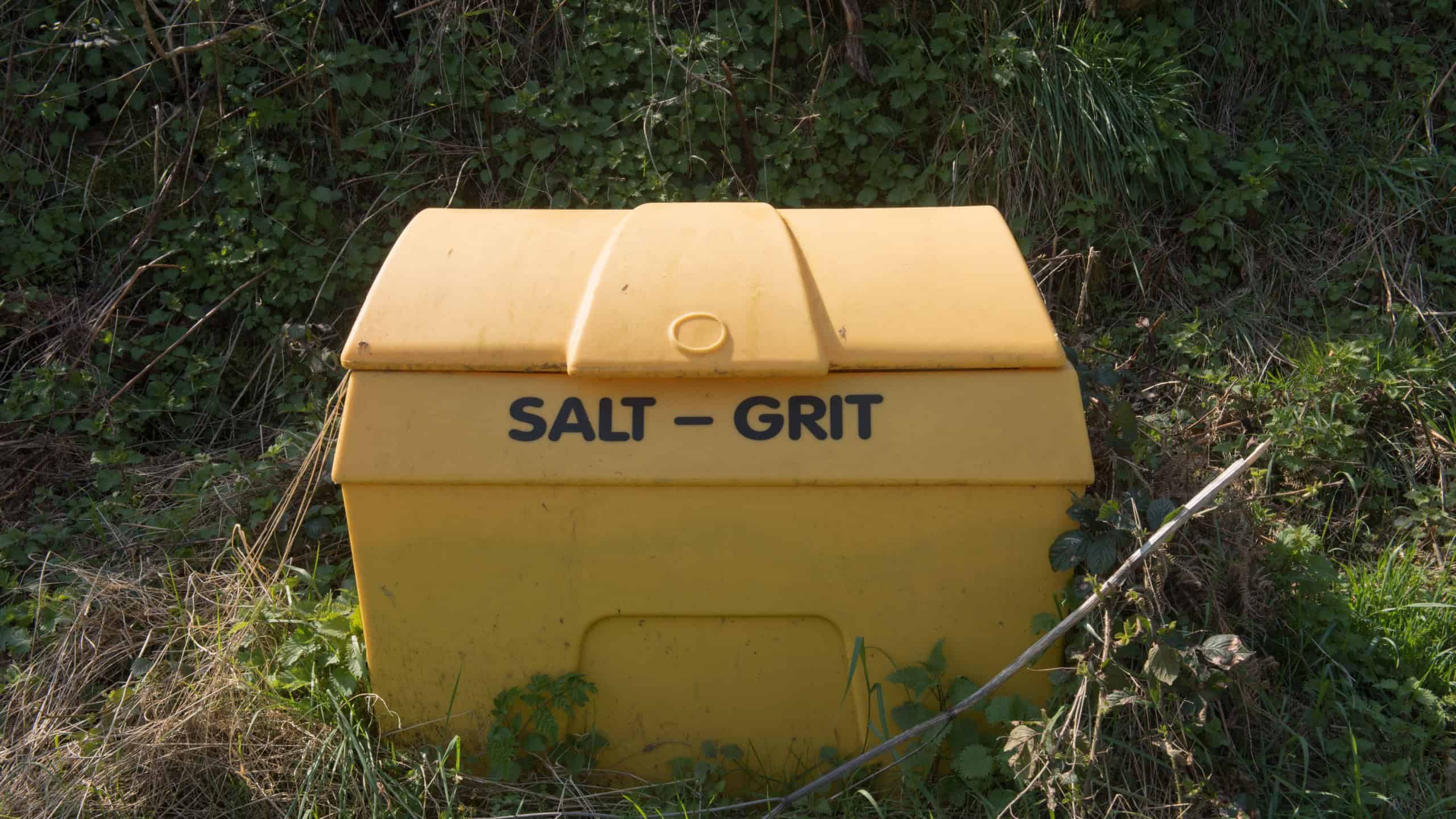 Yellow Plastic Storage Container for Salt or Grit on the Side of a Road