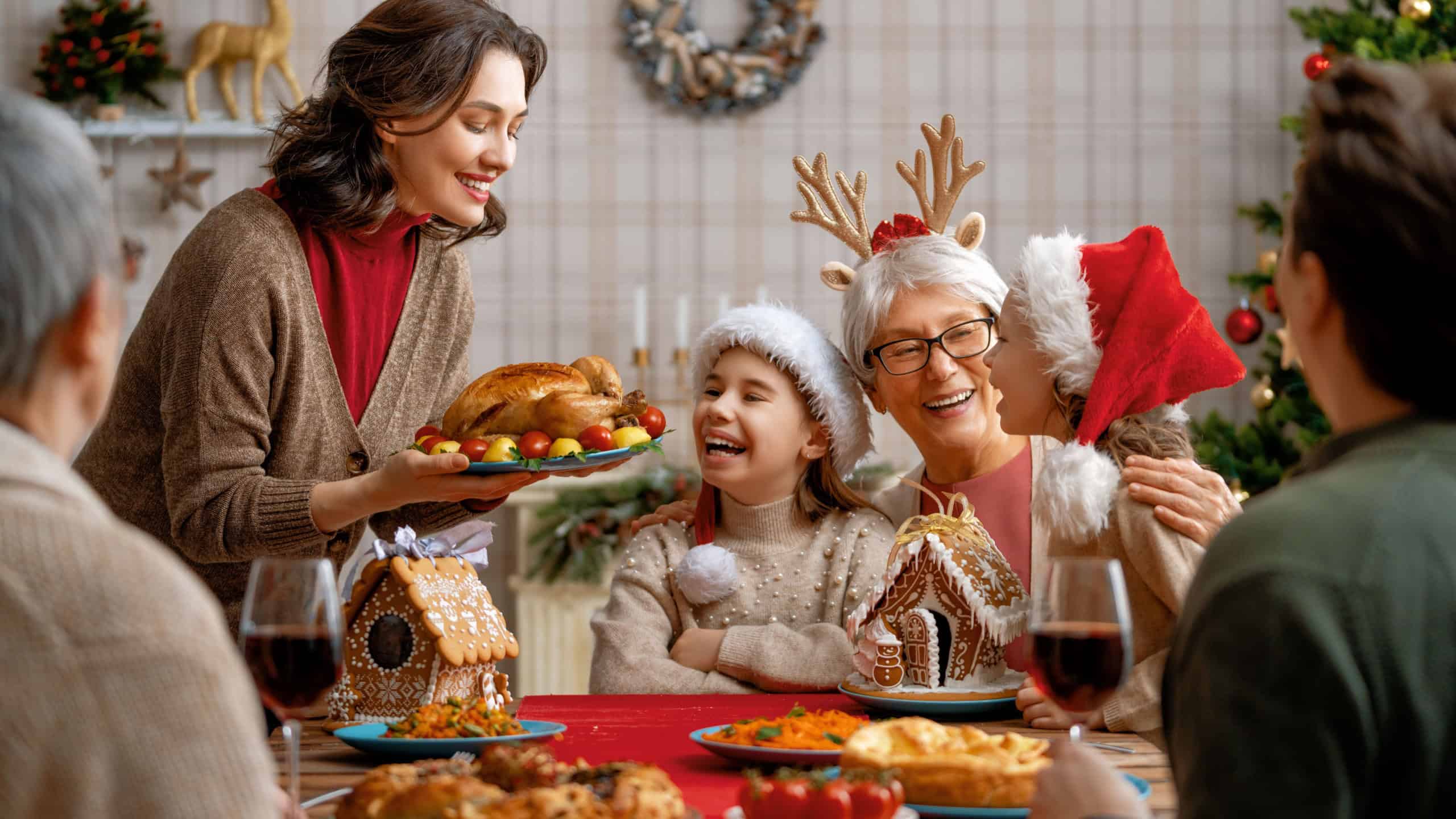 Merry Christmas Happy family are having dinner at home.