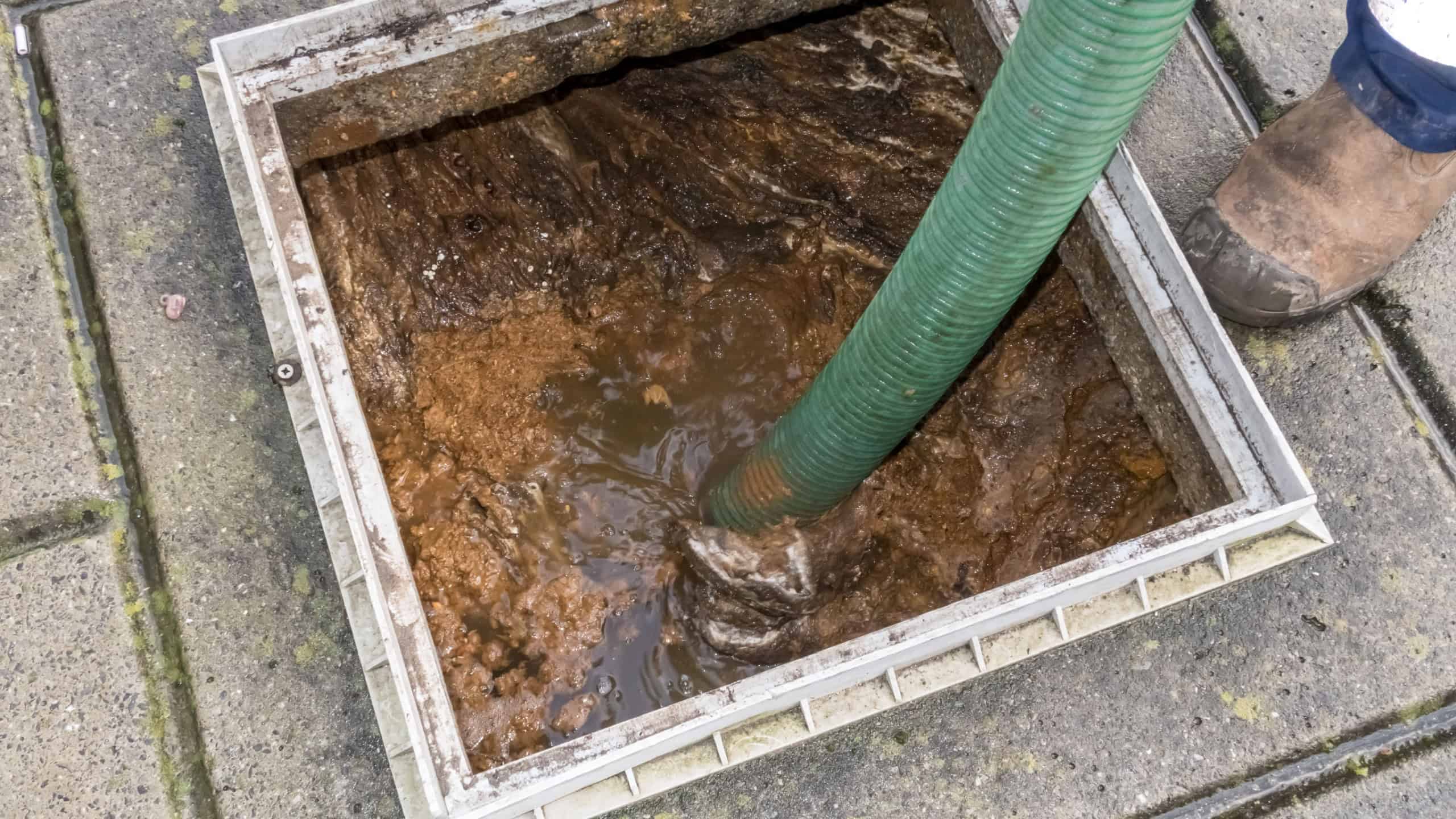Next to a large building for the students, the Cesspool overflows and the broader is sucking it empty