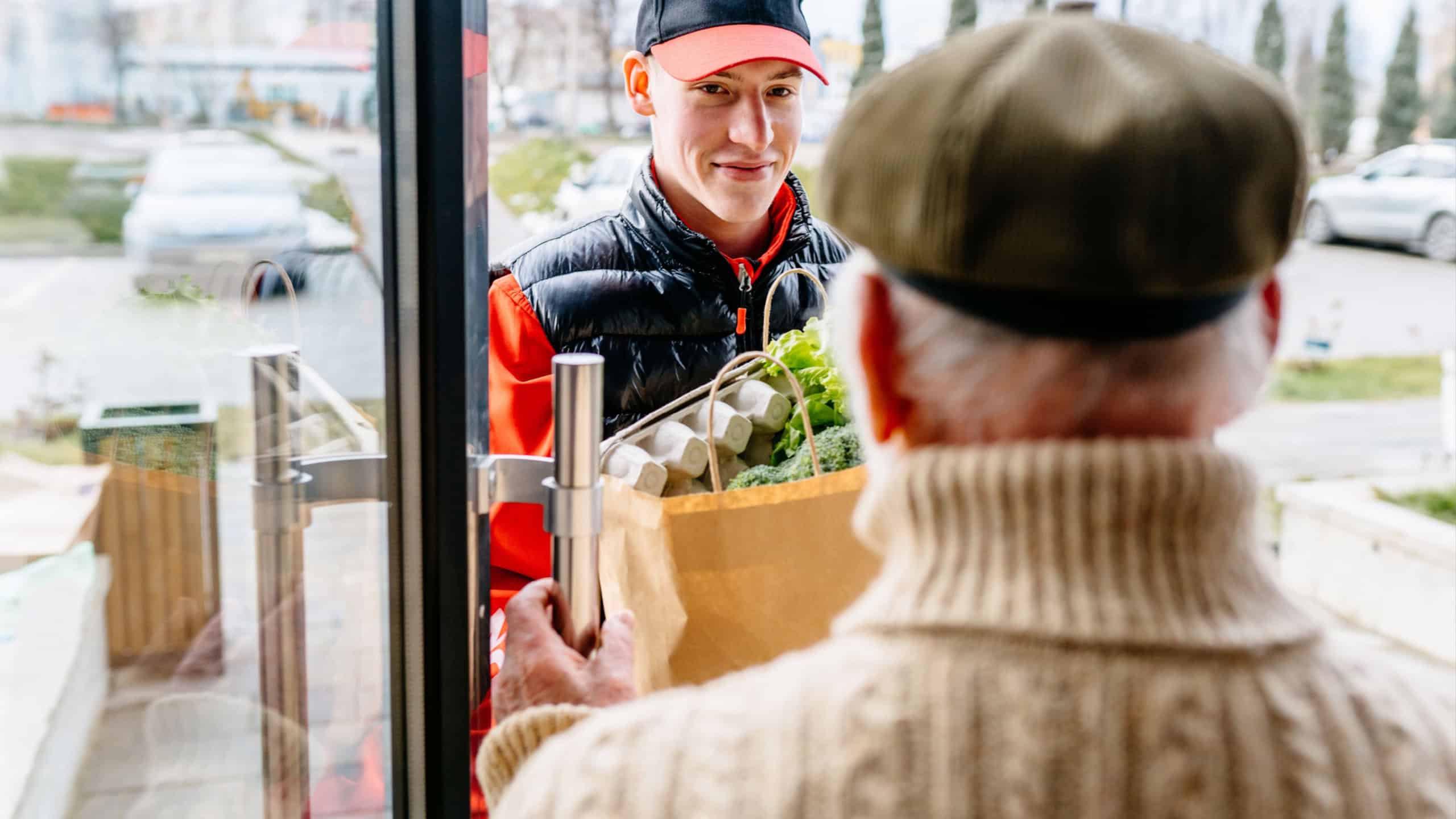 Fresh Groceries and Food Delivery for Elderly People. Old Senior Man Receiving Parcel. Meal Basket as Social Help and Support. Volunteerism.