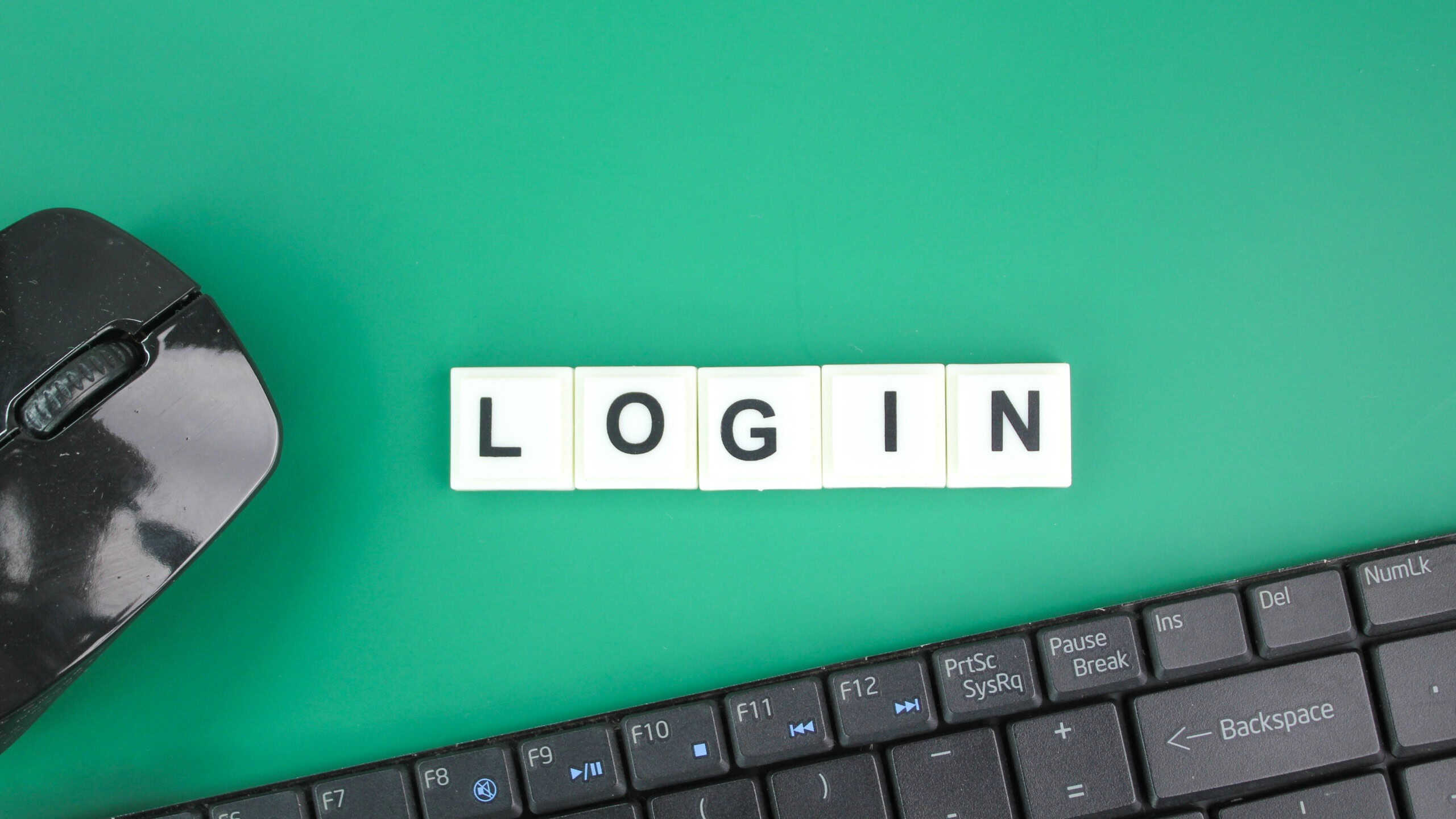Mouse and laptop keyboard with the word login. the concept of access. login concept