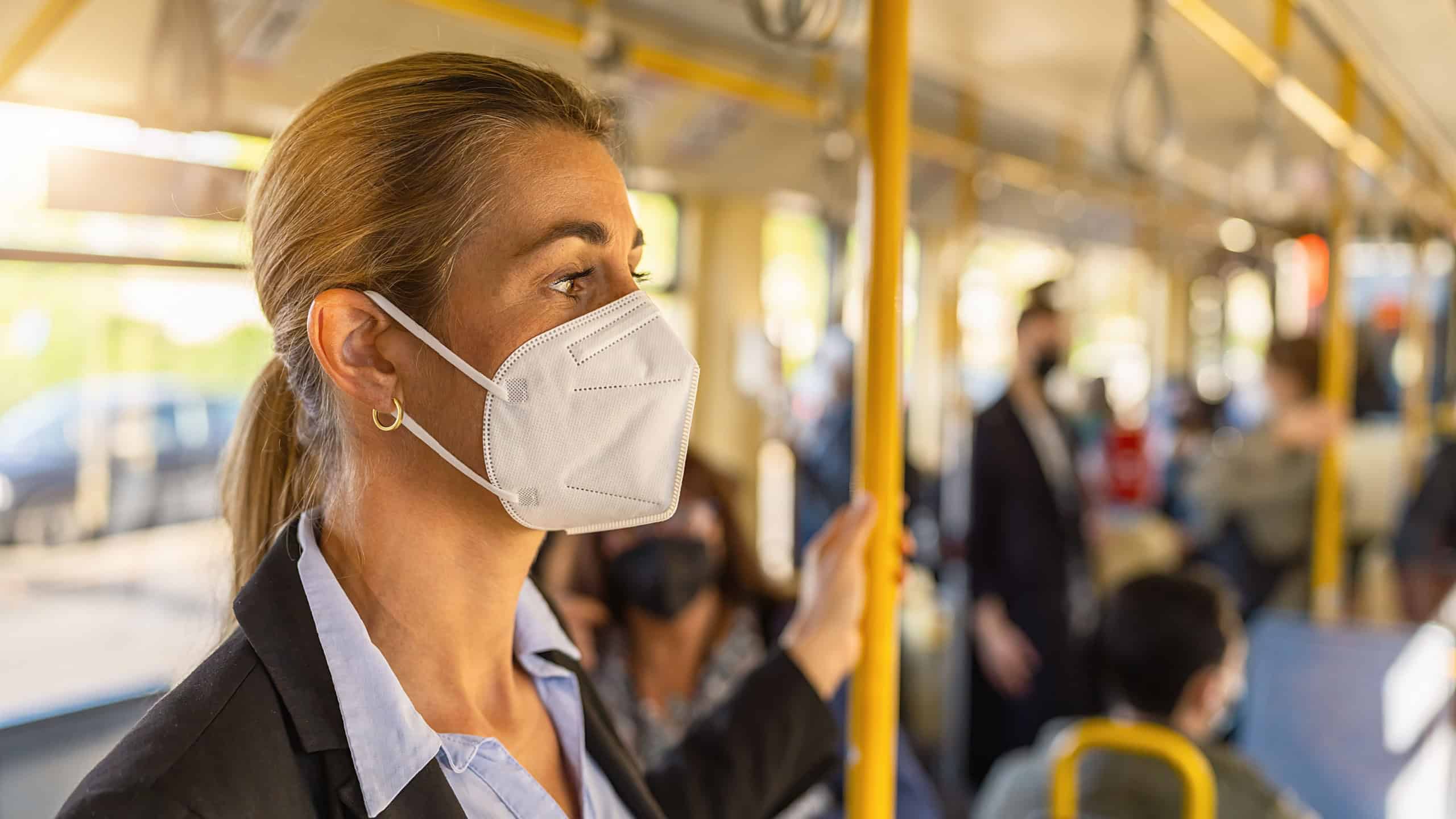 Woman with medical FFP3 mask in the subway