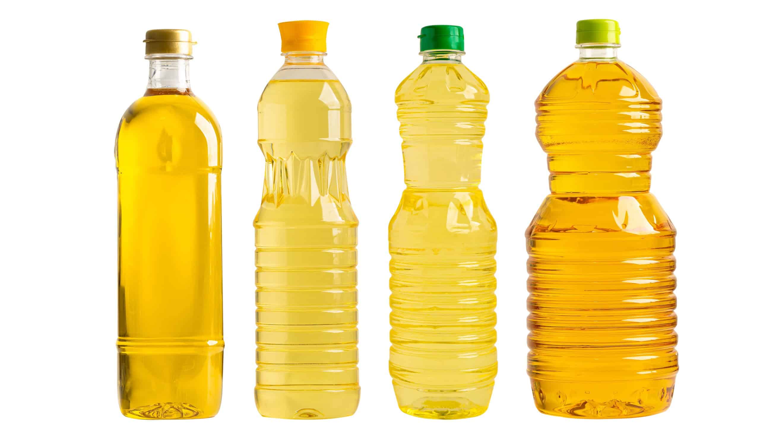 Vegetable oil with olive oil in different bottle for cooking isolated on white background with clipping path.