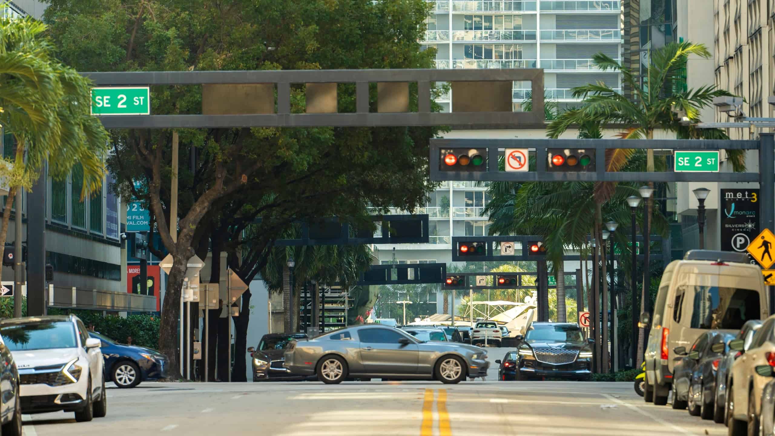 Cars traffic driving at intersection on street with traffic lights