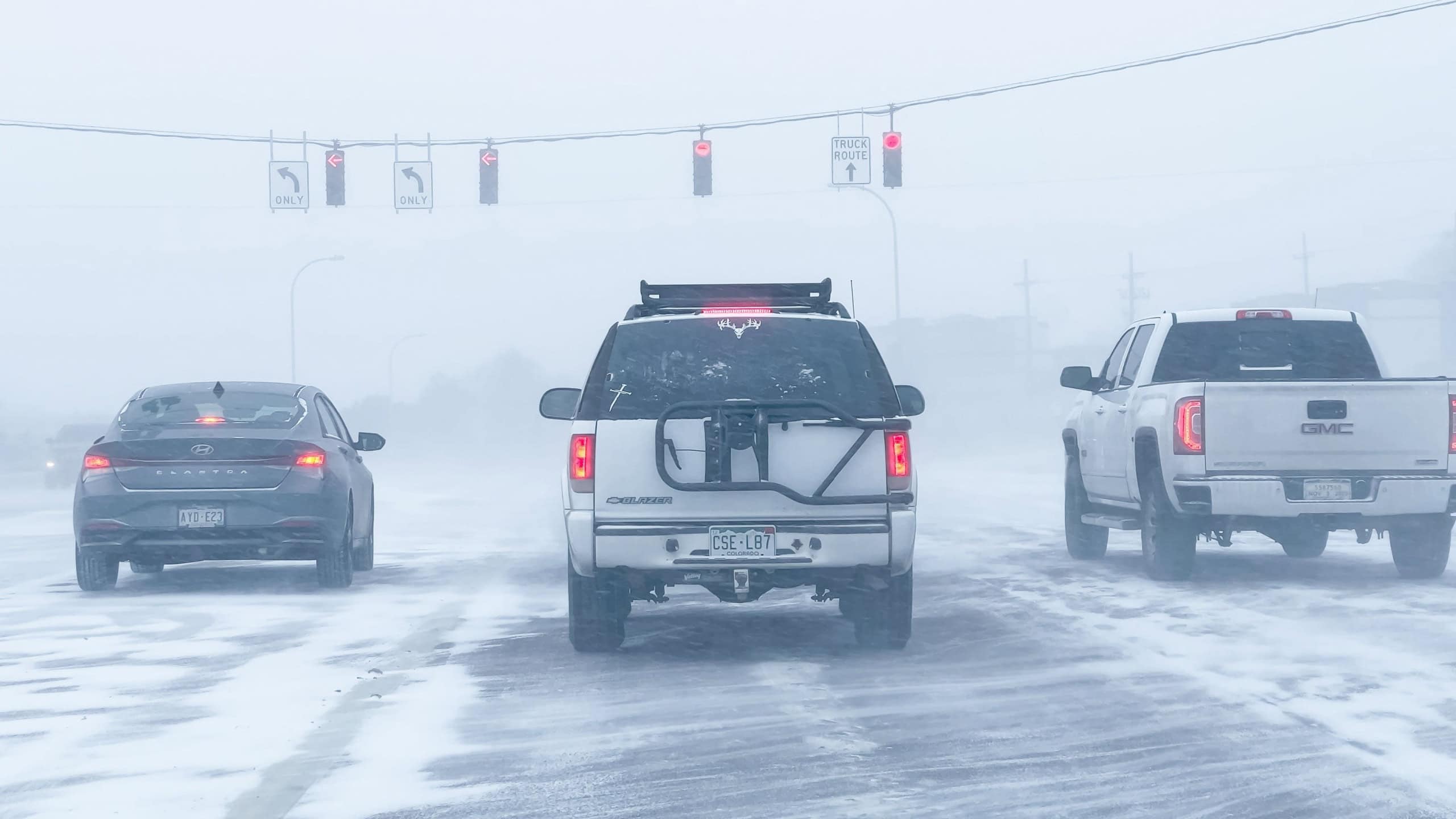 Denver, Colorado, USA-January 15, 2024-Several vehicles face blinding snowfall and slippery conditions while traveling on an interstate, with the storm reducing visibility and the road boundaries