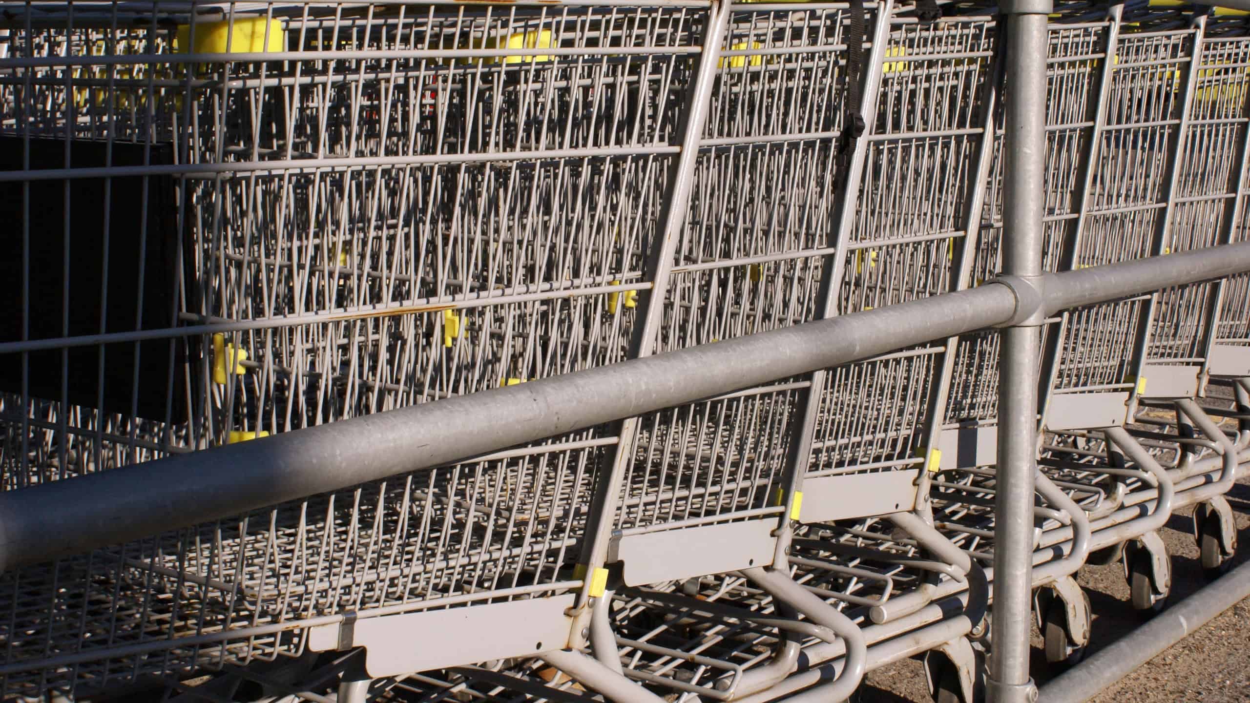 Closeup of several shopping carts at the mall return centre.