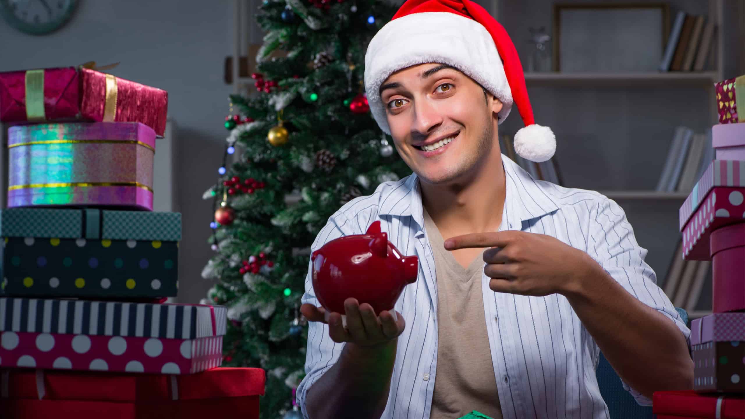 Man with many christmas gifts in boxes