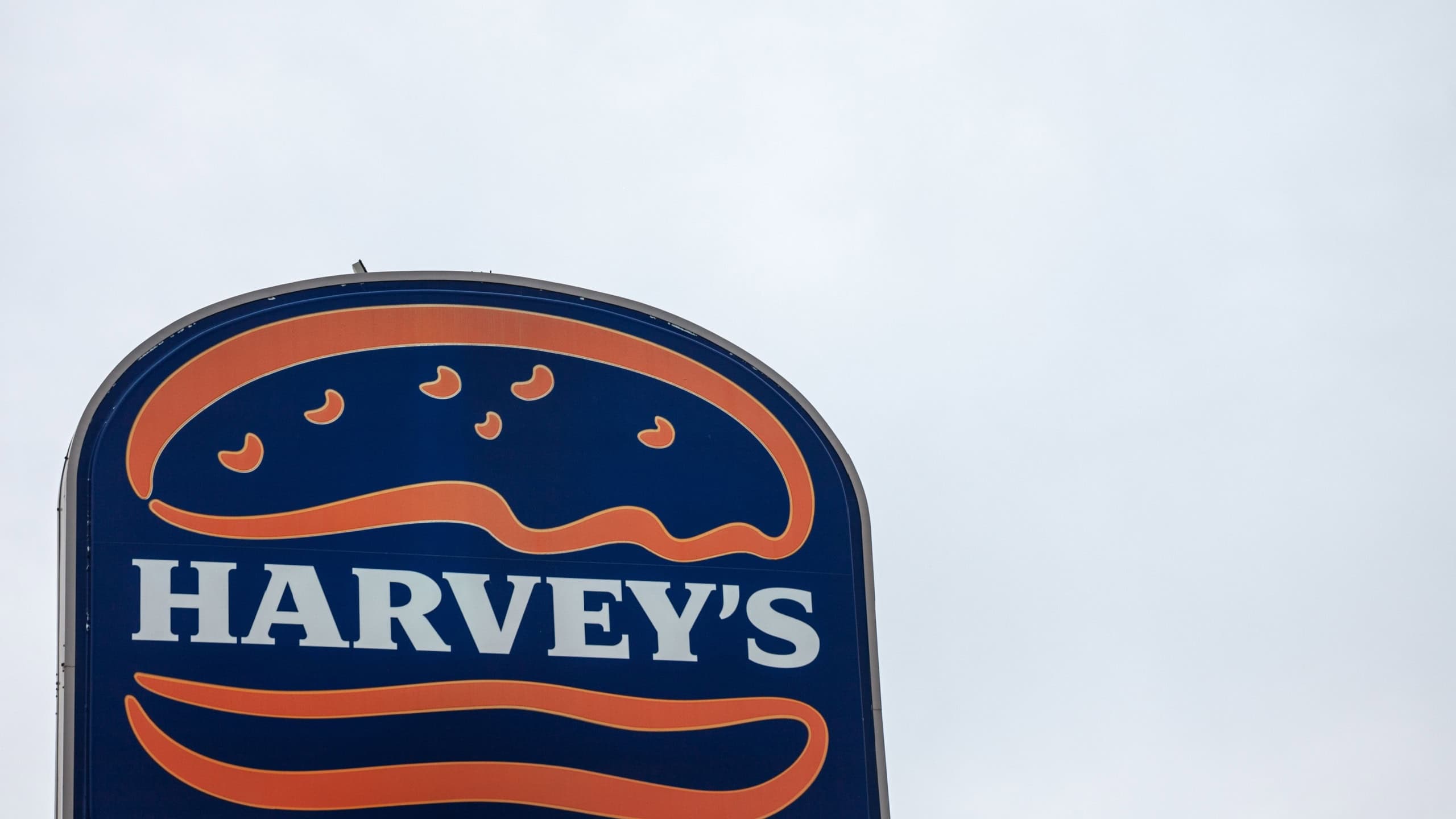 Harvey's logo, in front of one of their fast food in Montreal