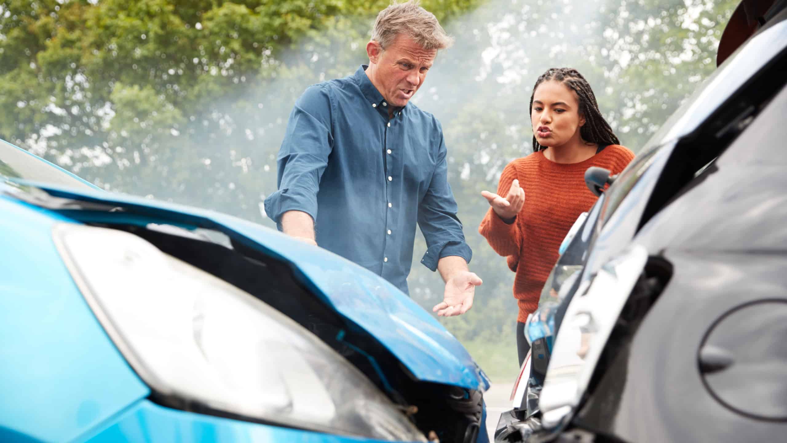 Two Angry Motorists Arguing Over Responsibility For Car Accident