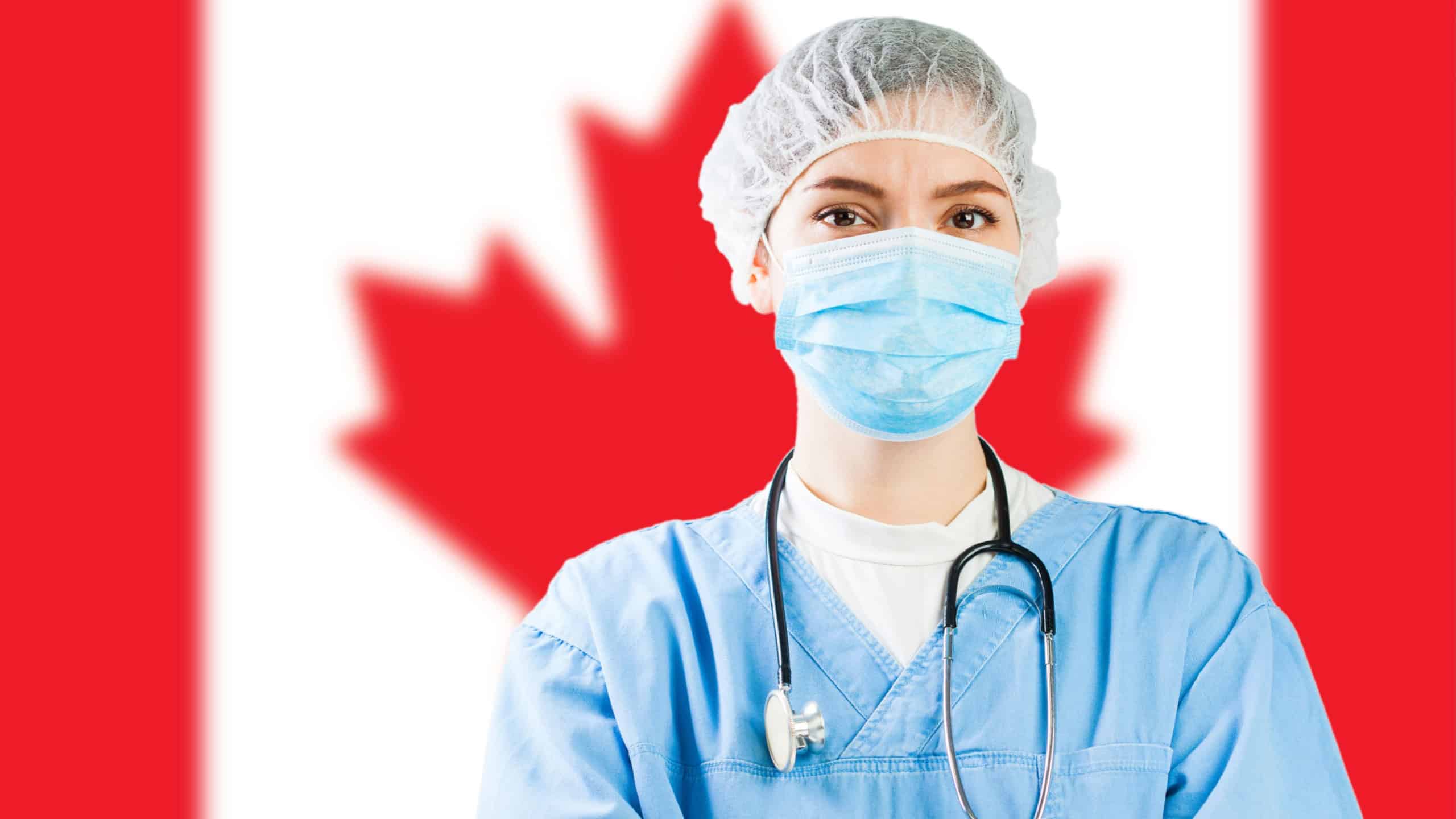 Portrait of caucasian doctor or nurse with Canada flag in background