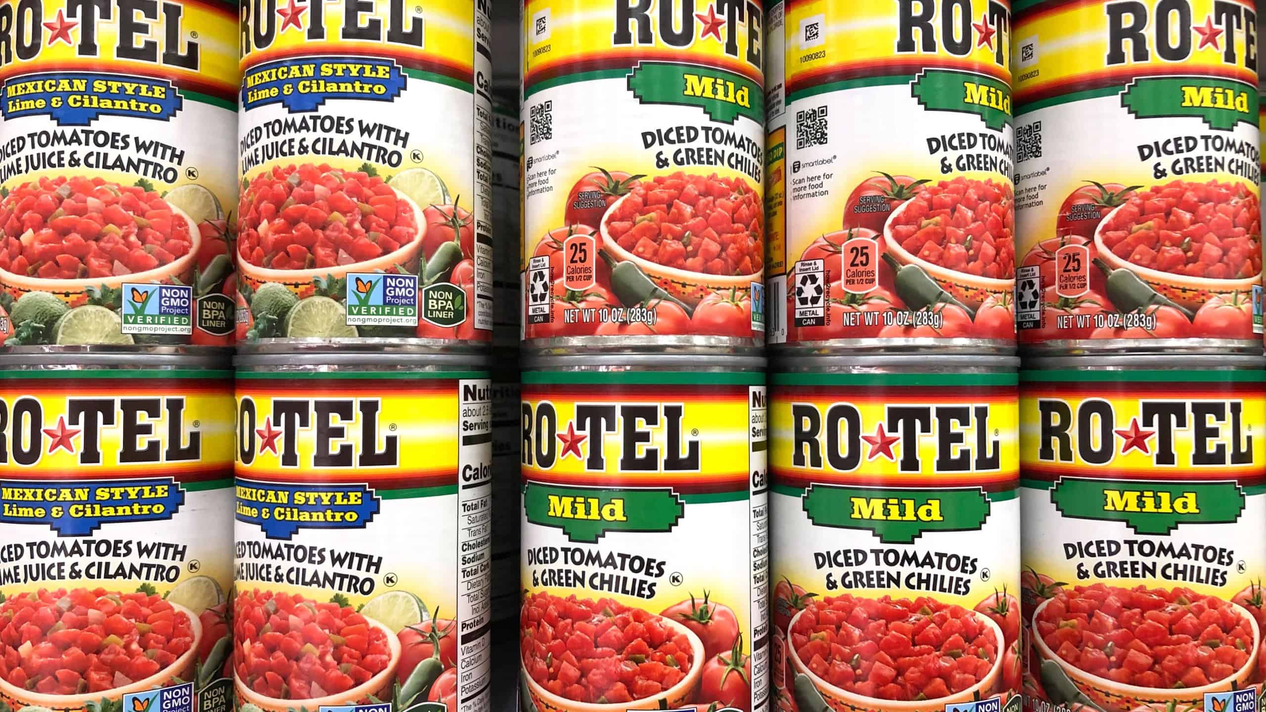 Alameda, CA - Oct 28, 2020: Grocery store shelf with cans of Rotel brand diced tomatoes, mild with green chilies and Mexican Style with cilantro and lime juice.