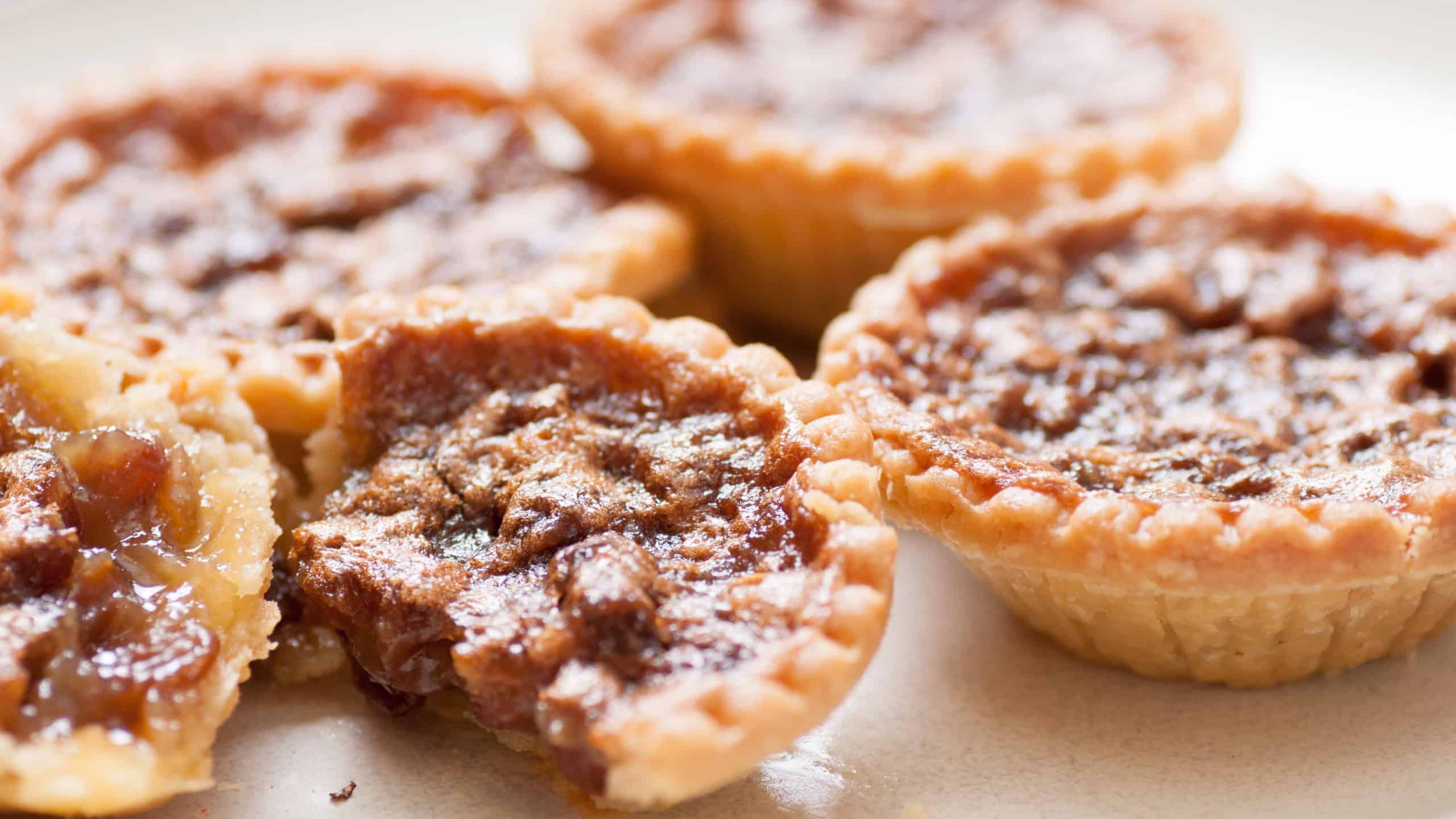 Delicious butter tarts with raisins and a flaky crust