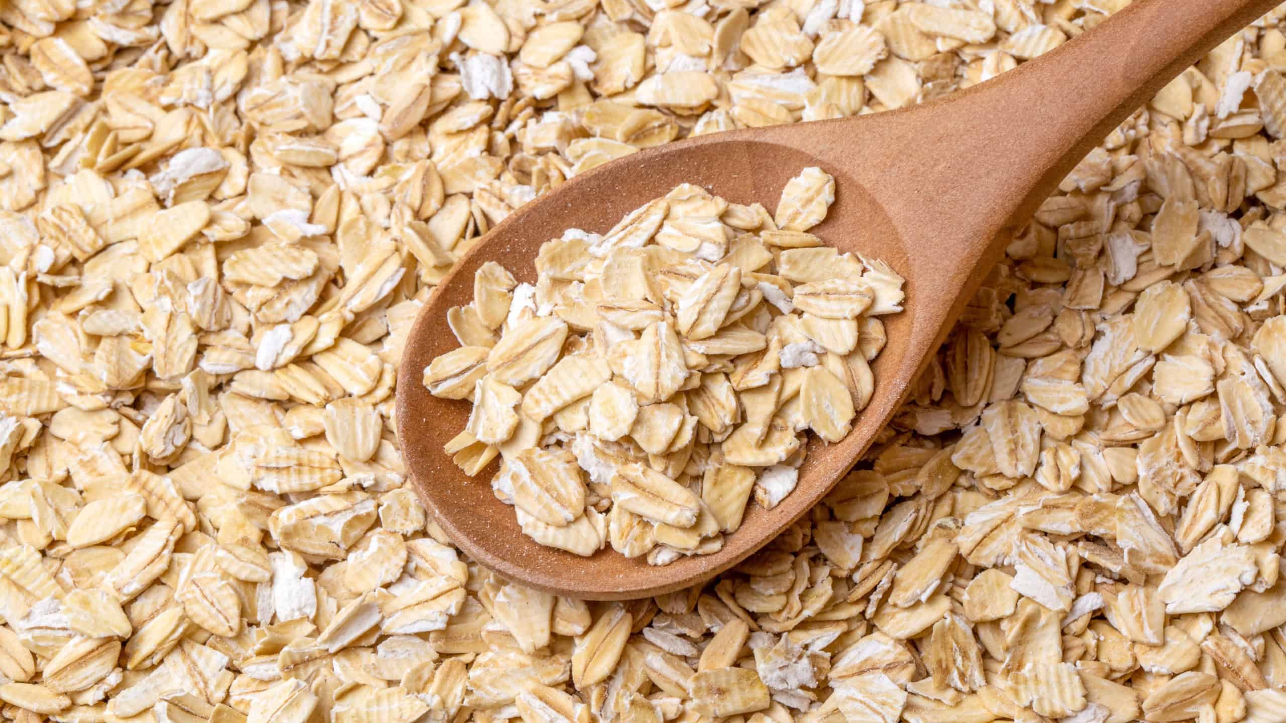 Heap of dry rolled oats isolated