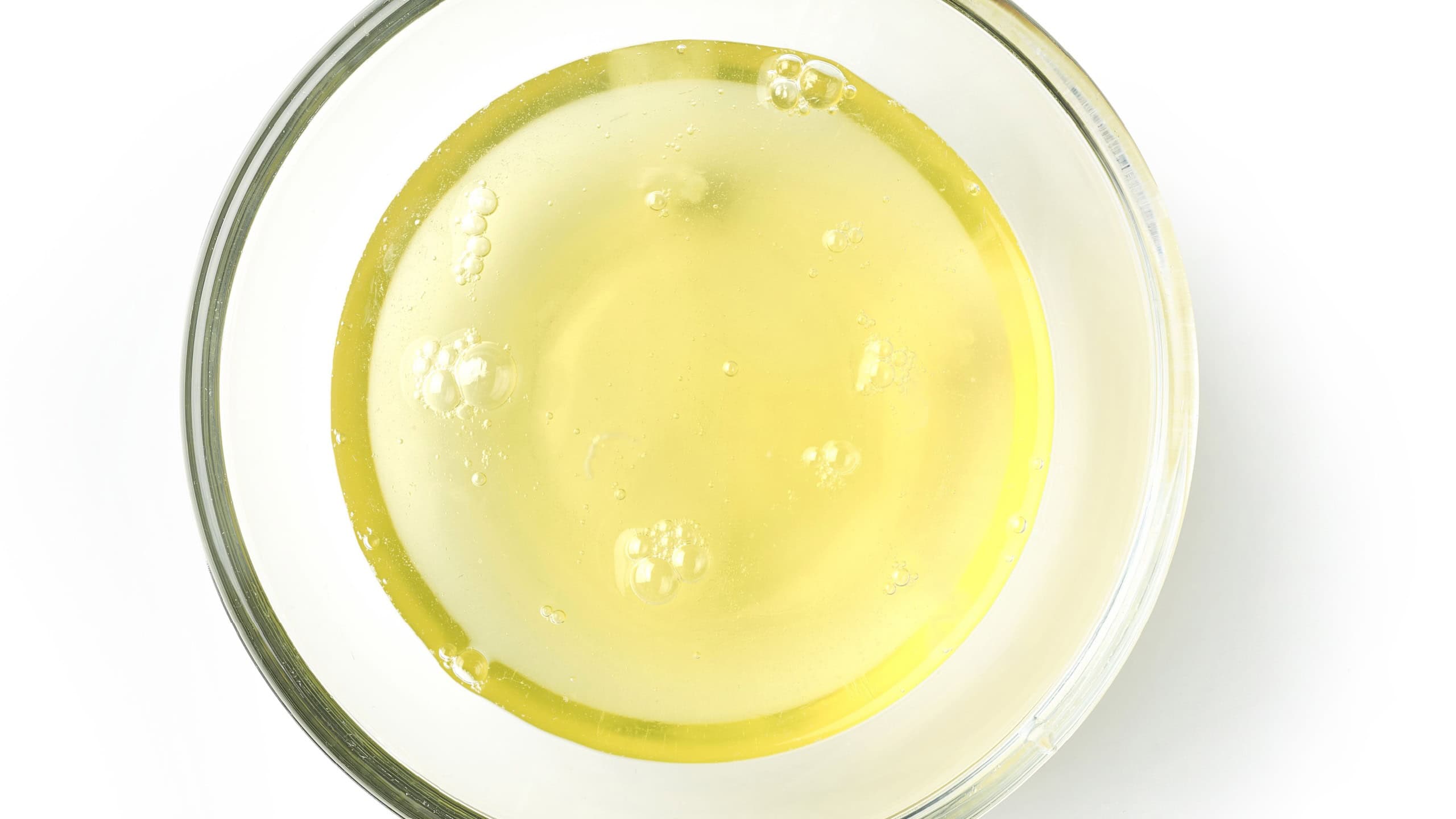 bowl of egg whites isolated on white background, top view