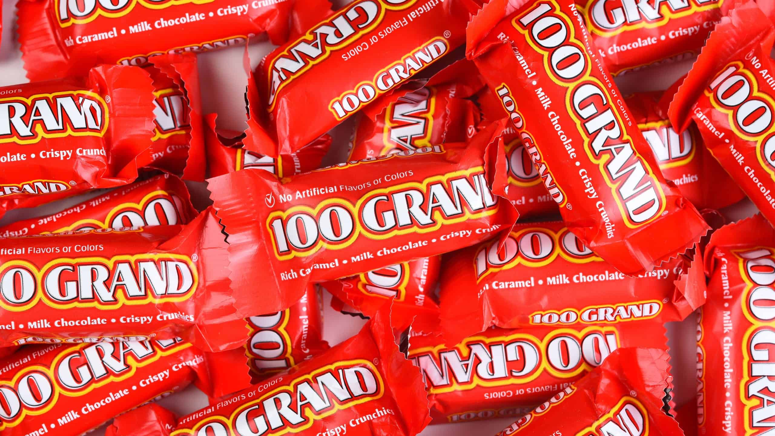 IRVINE, CALIFORNIA - 23 SEPT 2021: A large pile of 100 Grand Fun Size Candy Bars for Halloween.