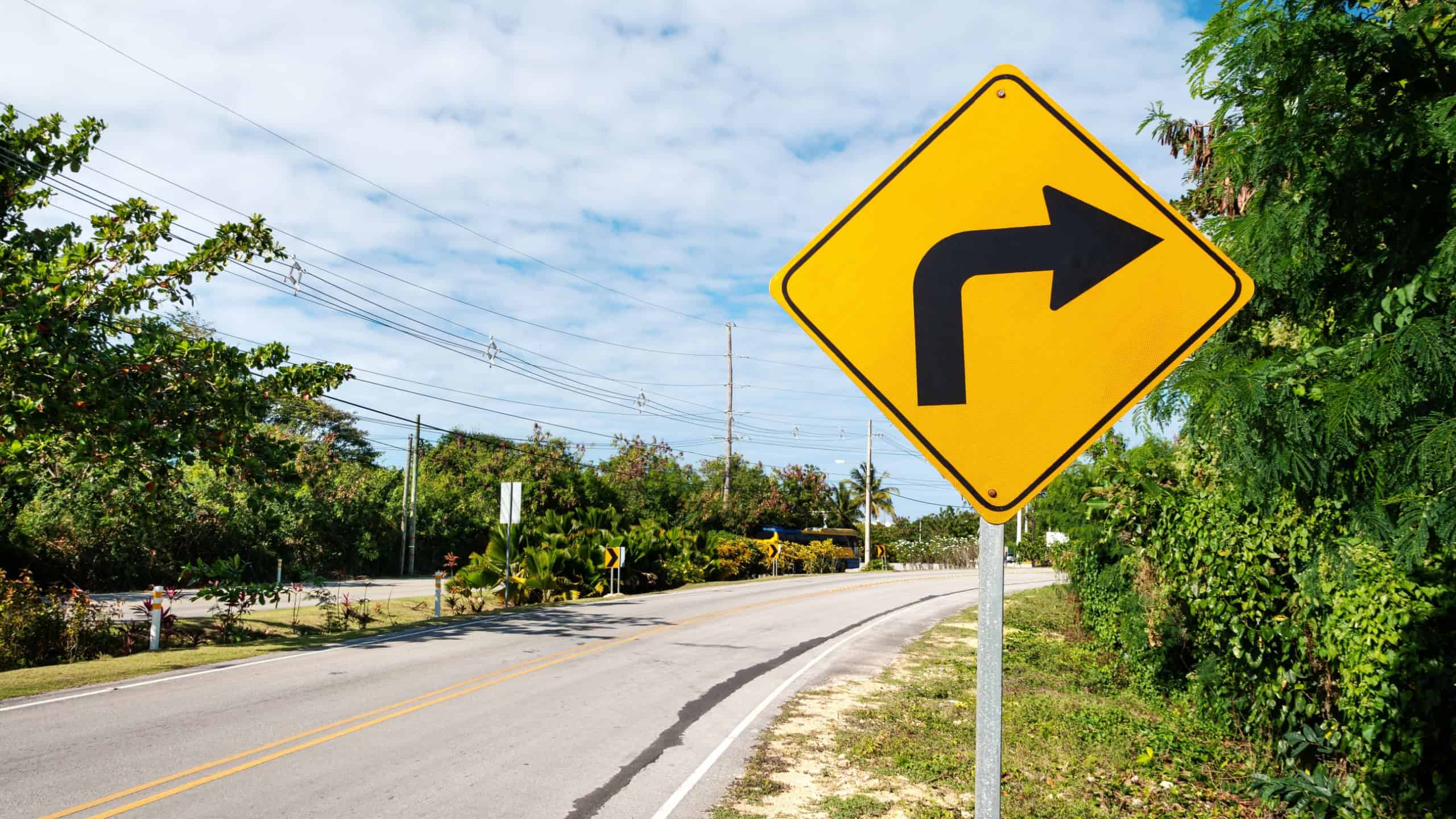Traffic road sign turn right on empty highway without cars in Dominican Republic, nobody