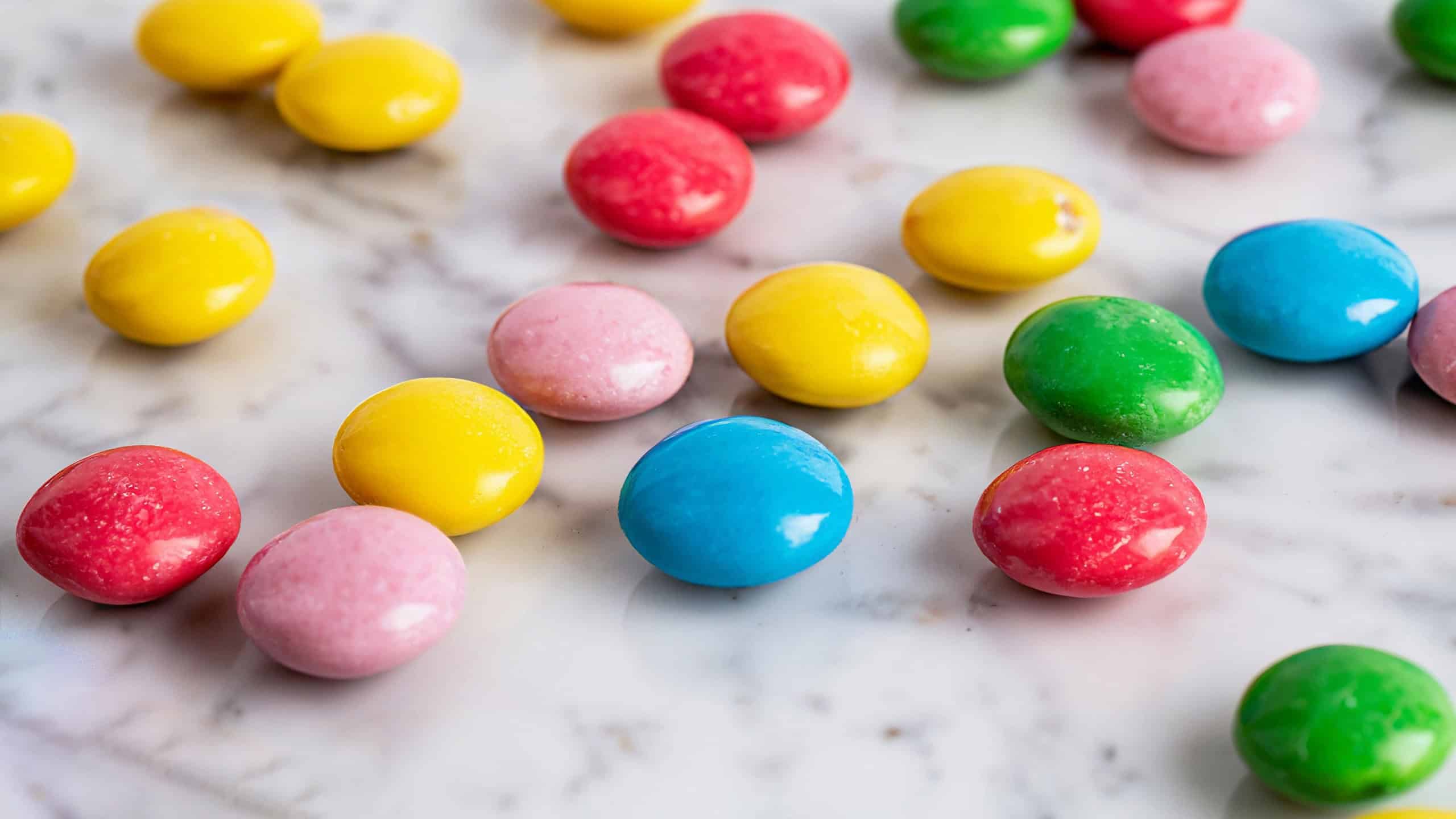 Some smarties closeup on a white background