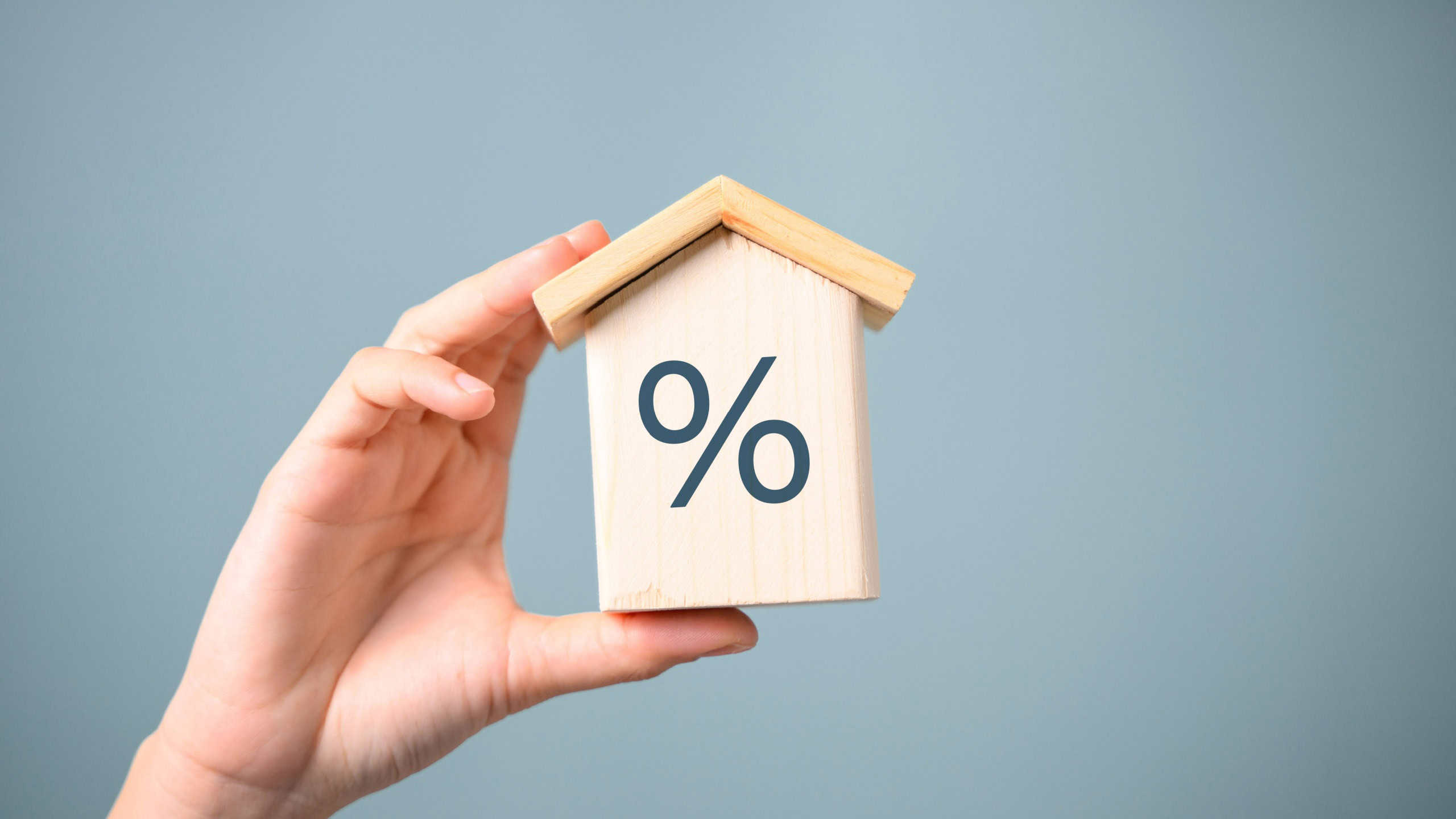 interest percent symbol icons on wooden house cube, home real estate.